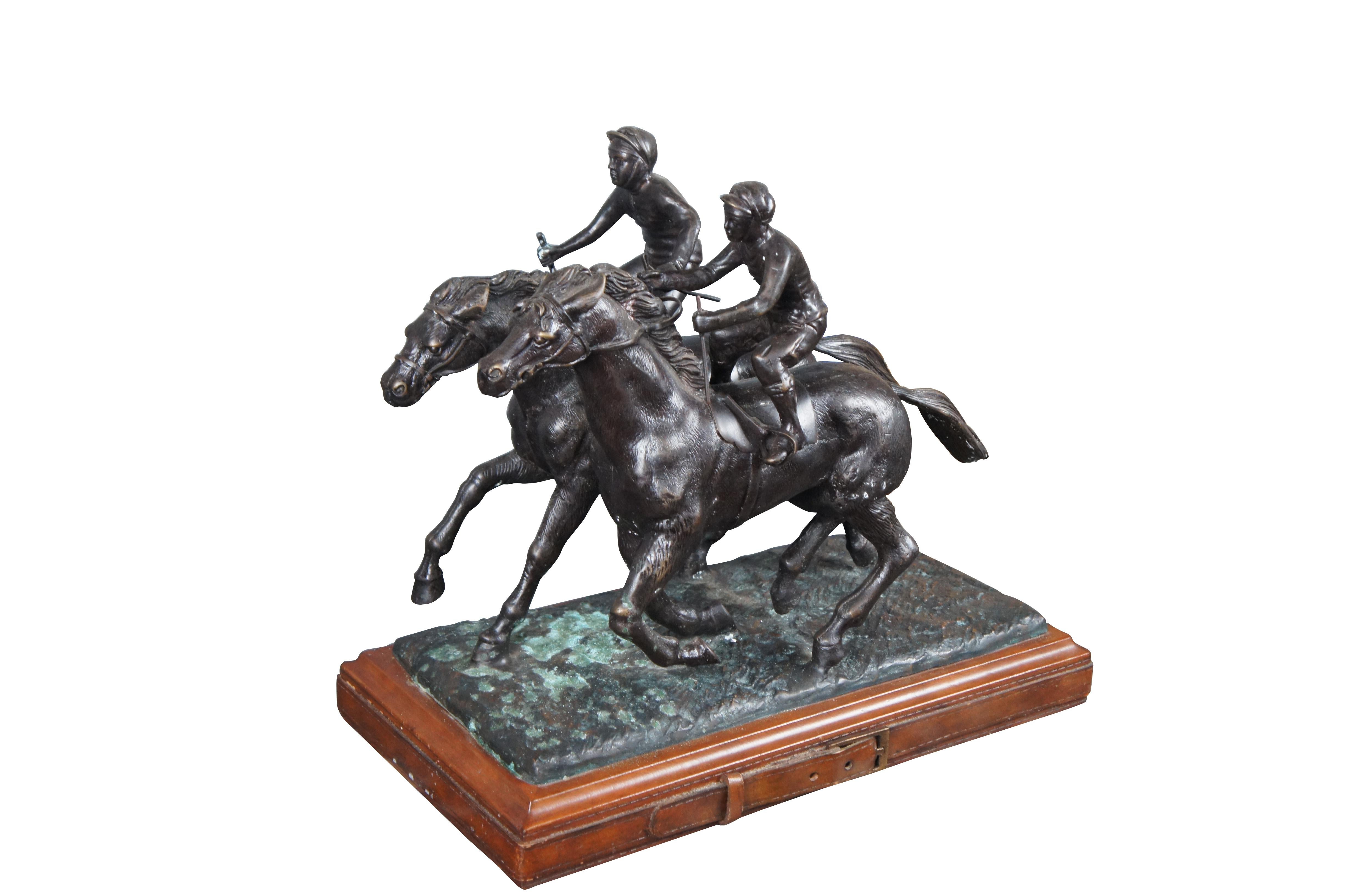 Vintage Maitland Smith bronze two jockeys on horses equestrian racing statue featuring leather wrapped base.

Dimensions:
17.5