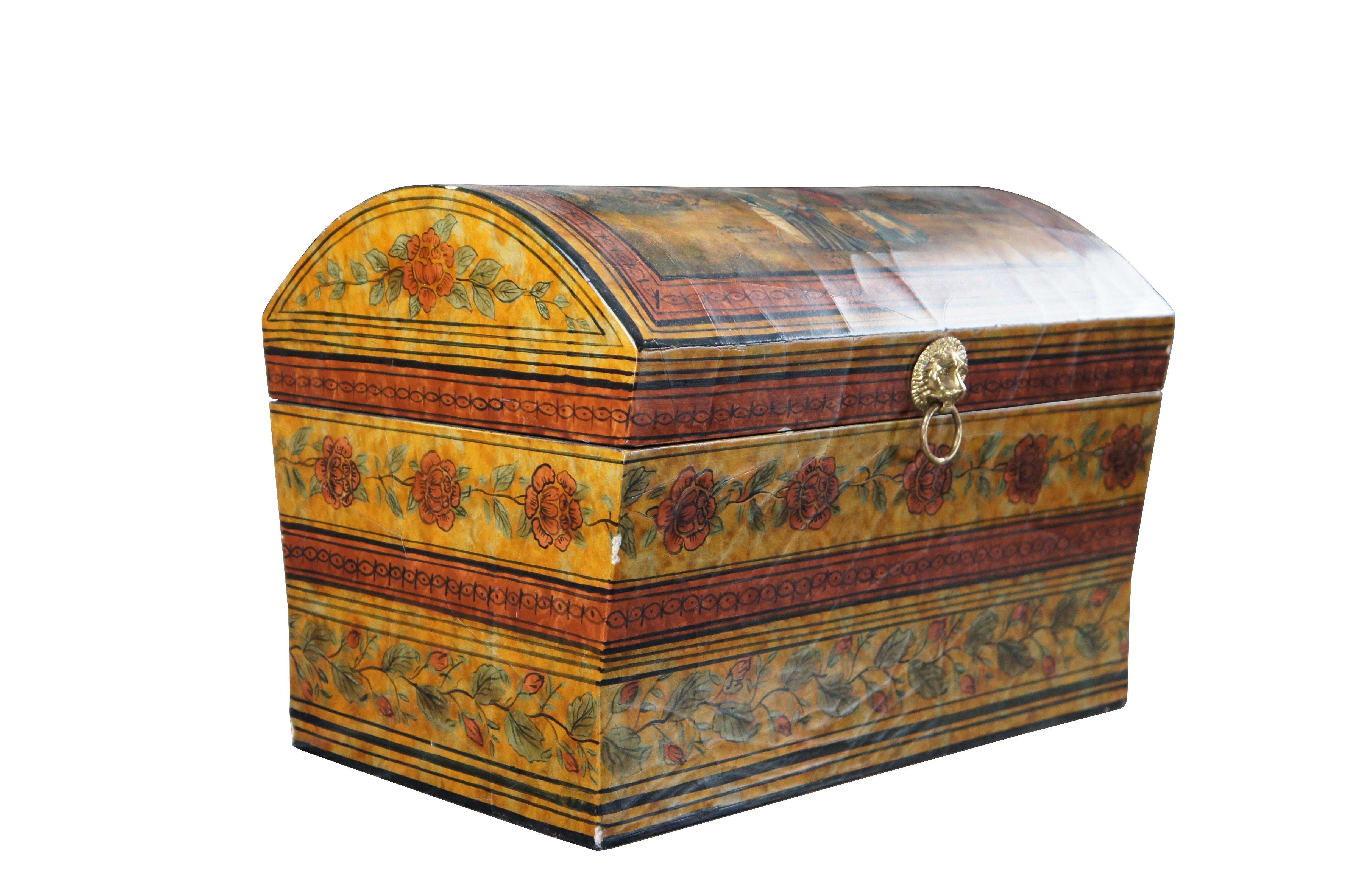 An impressive lacquered keepsake box by Maitland Smith, circa 1990s. Features a chinoiserie motif with flowers and Asian figures. the box is in the form of a treasure chest with hinged lid and black interior. Includes brass lion head handle along
