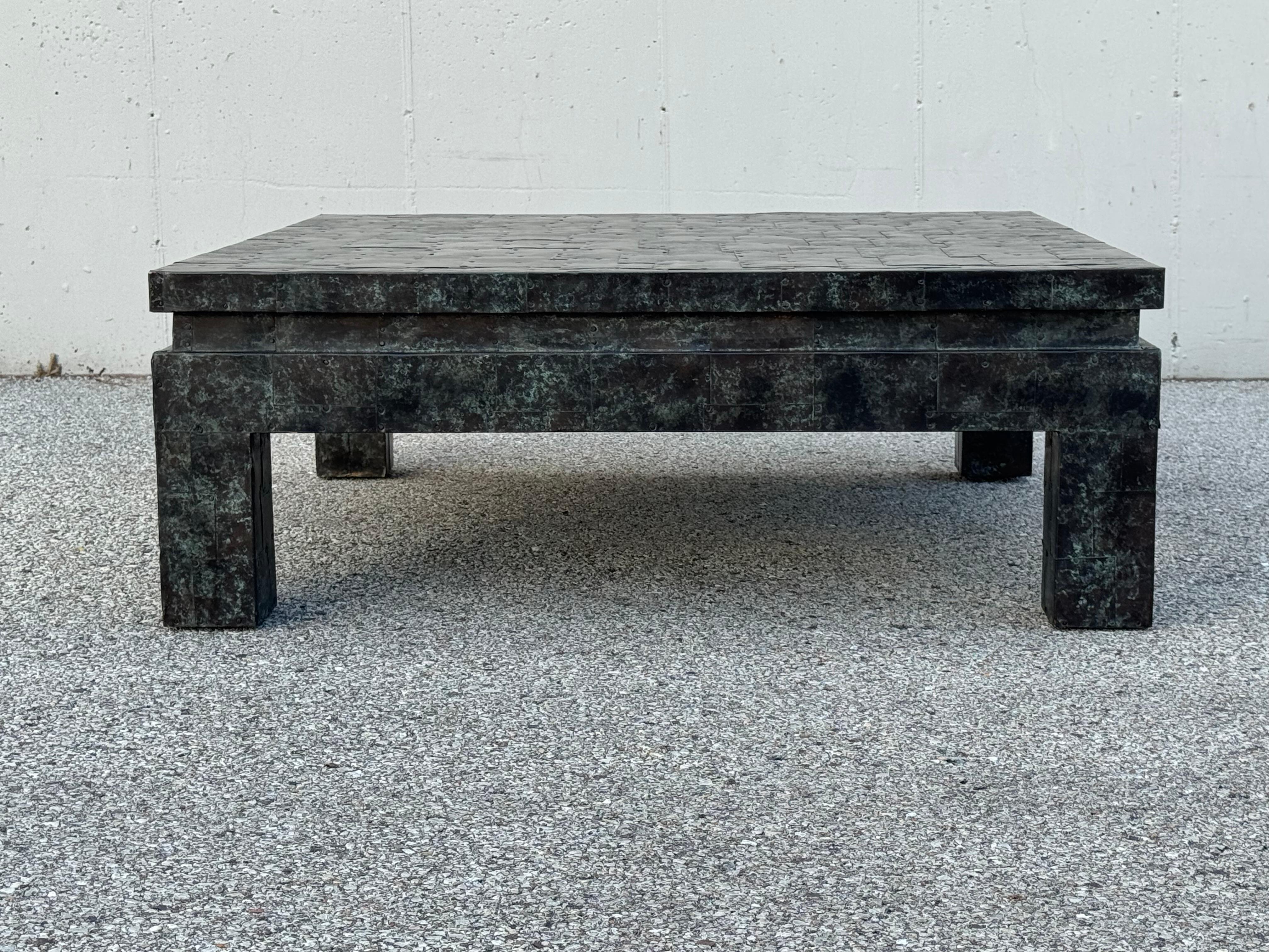 Beautiful Maitland-Smith large square coffee table on square legs, entirely covered with patinated copper patchwork tiles attached by nails. In the style of mid-century modern sculptor and designer Paul Evans. A rare find !
