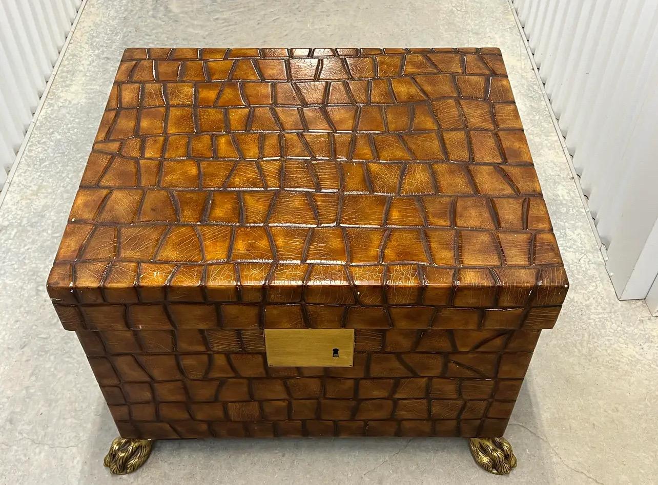 Introducing the exquisite Maitland Smith Leather Claw Foot Trunk Coffee Table. This exceptional piece is crafted by Maitland Smith, renowned for their exceptional craftsmanship. The trunk-style coffee table is beautifully adorned with luxurious