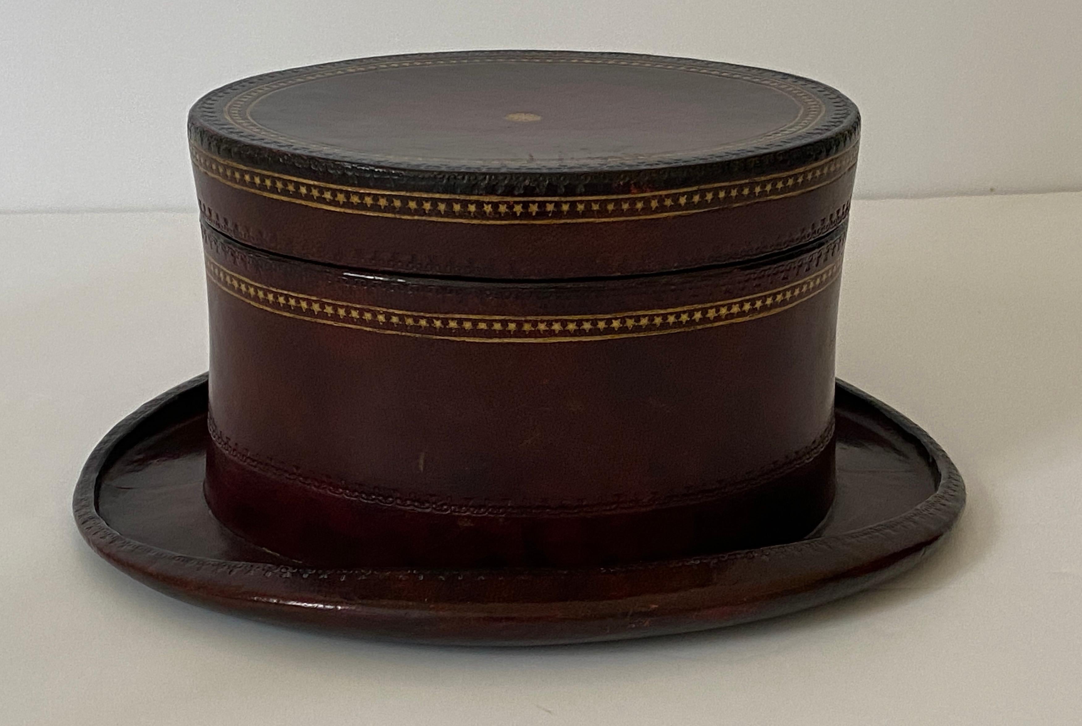 This stylish, whimsical and chic storage box dates to the 1980s and was created by Maitland Smith. The deep cordovan leather is highlighted with hand tooled, gilt gold edging.