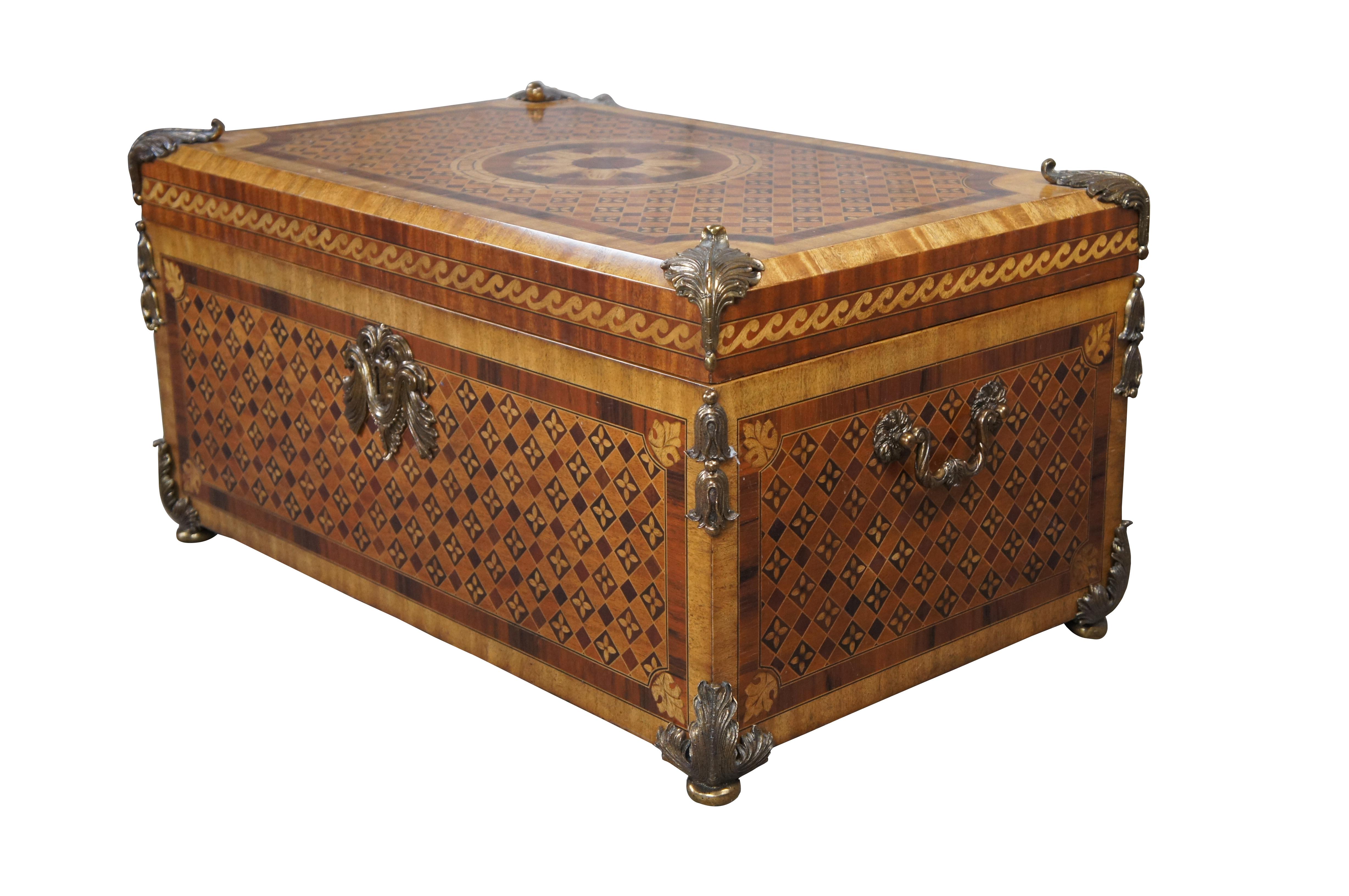 Exquisite marquetry chest by Maitland Smith, Circa 2000s. Made from mahogany with geometric diamond patterned marquetry, crotch burled panels, inlay and brass ormolu mounts. Opens via brass hinges for storage. A stately design that will draw