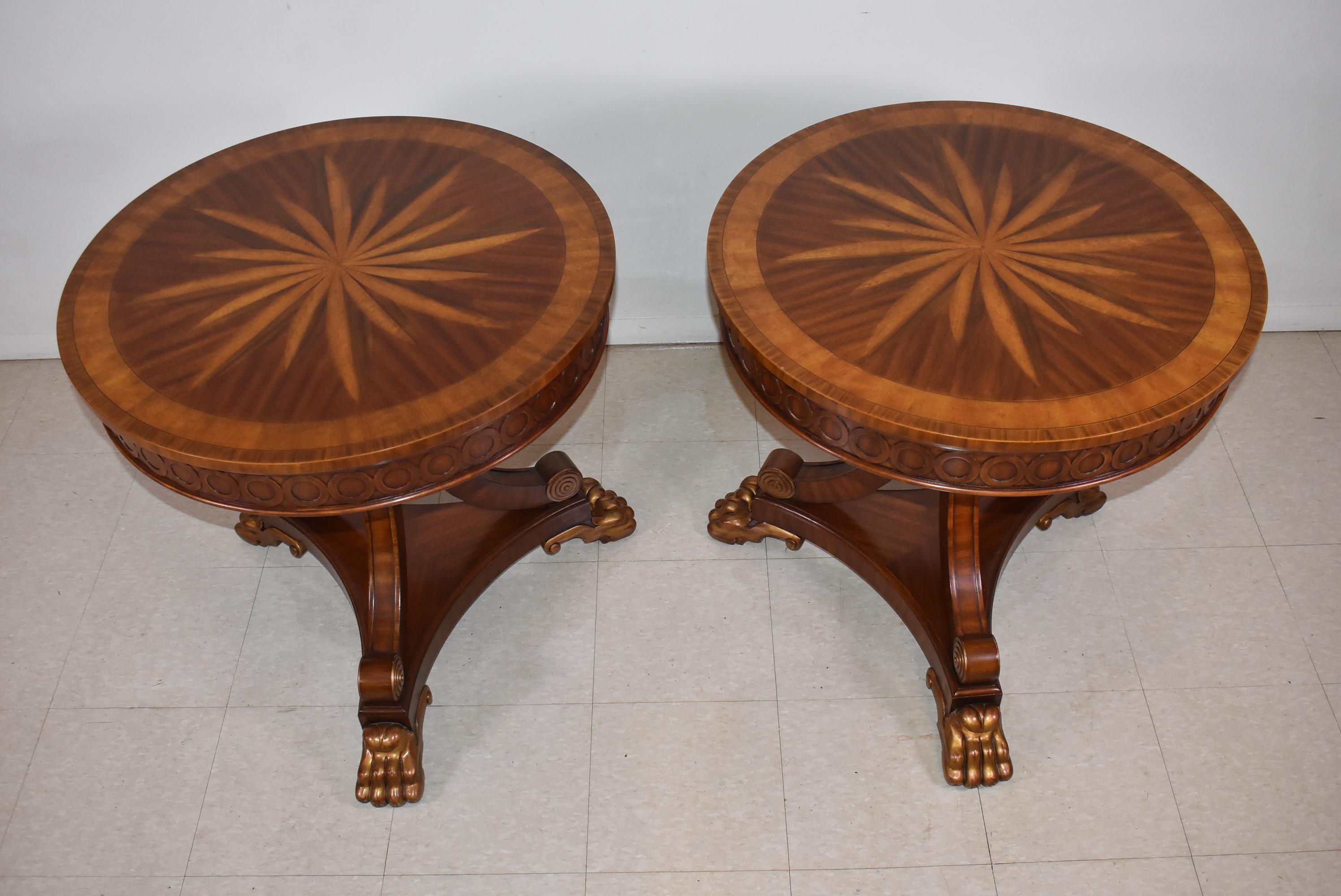Striking compass table by Maitland Smith in carved mahogany with a satinwood inlaid top and carved detail edge. The  pedestal is formed by three curved legs on a platform base supported by carved claw feet. Excellent condition. 30