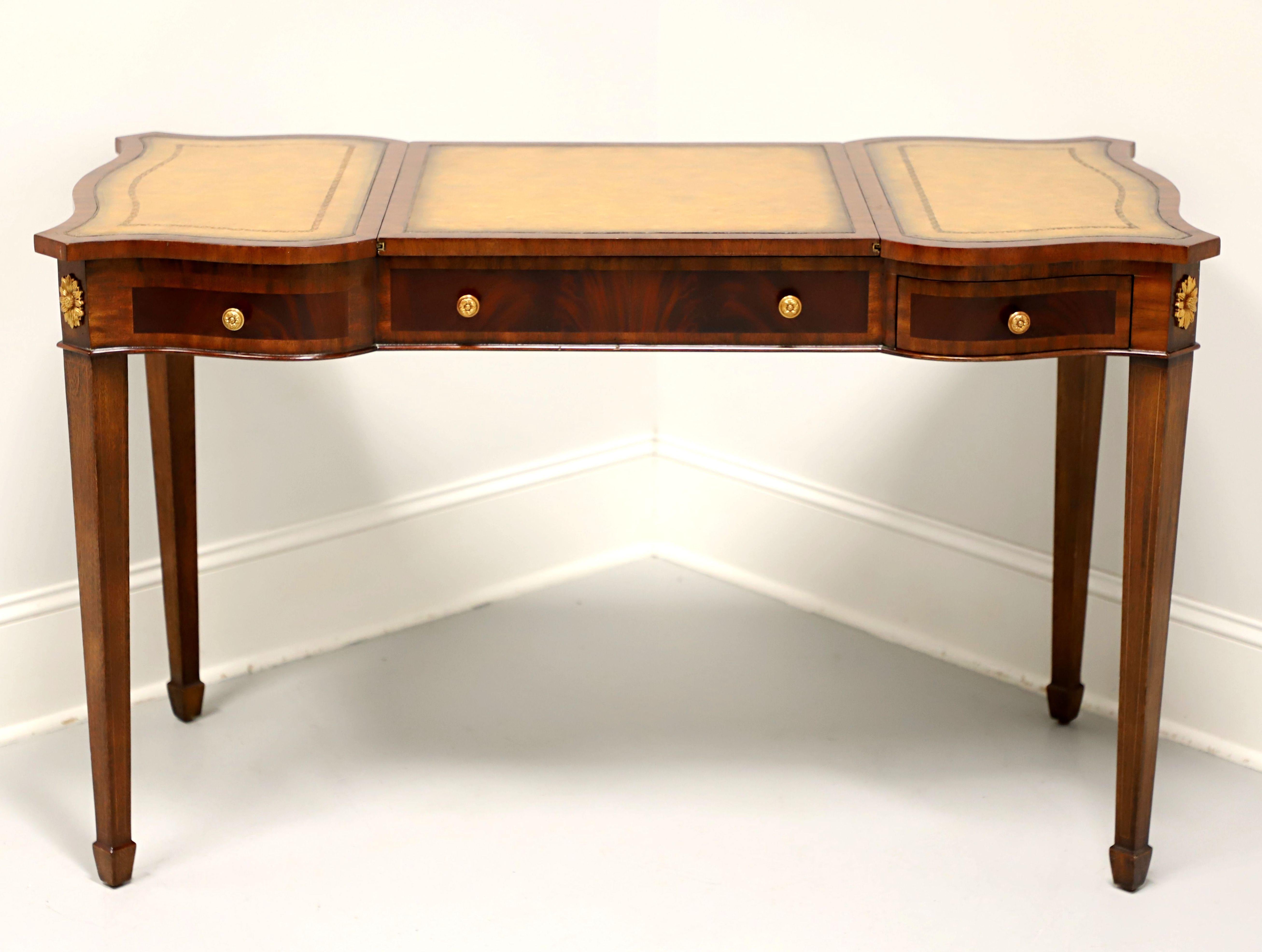A Regency style writing desk / game table by Maitland Smith. Mahogany with banded drawer fronts, tooled & embossed leather top, reversible & removable top center section, slide-out side trays that extend leather desk top surface, brass hardware &
