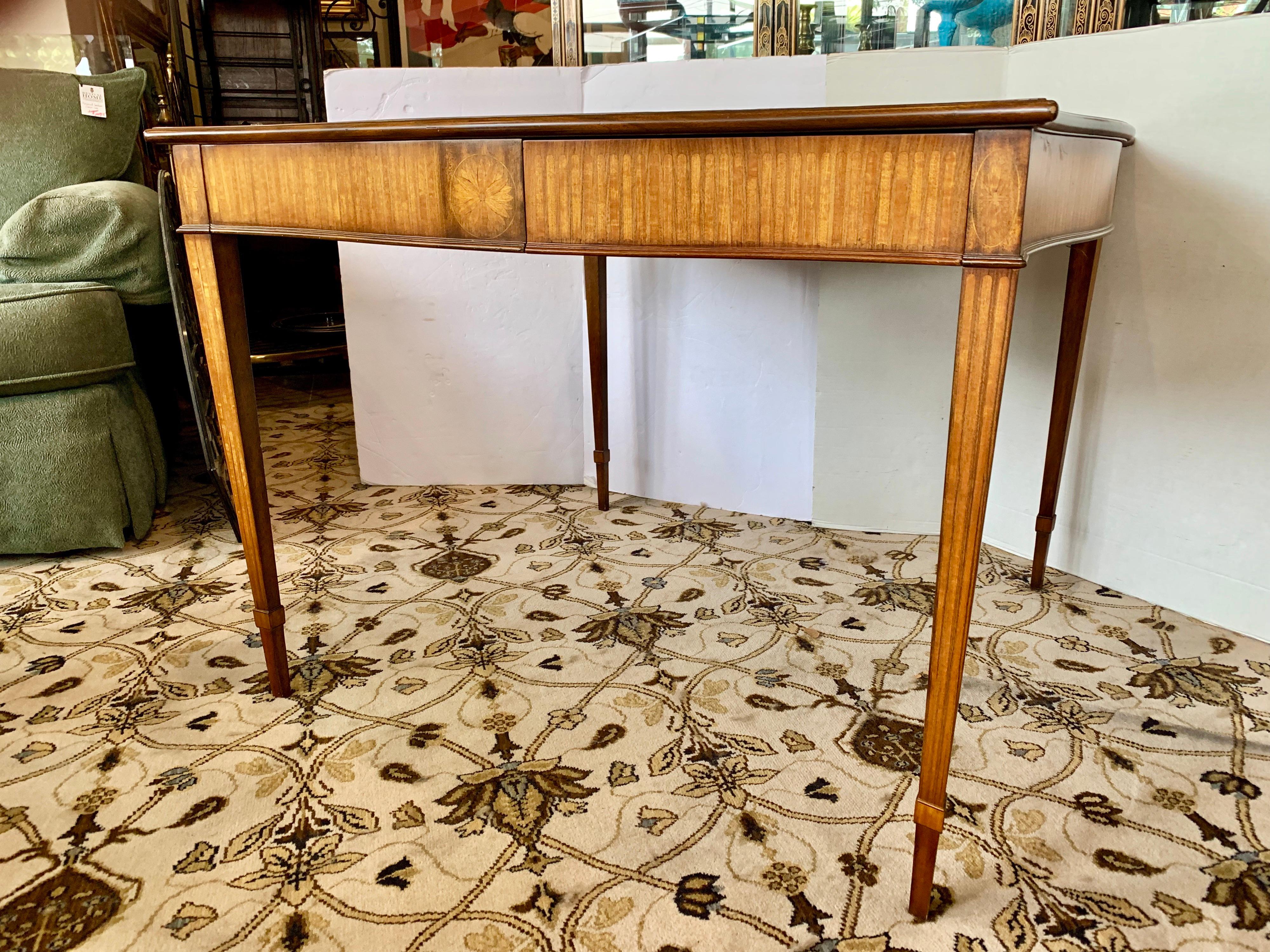 Elegant mahogany signed Maitland Smith large game table with drawer on all four side. Features leather top and carved legs. All maker hallmarks are at bottom of table. Would work great in a study, library, game room or office. Use as a game table or