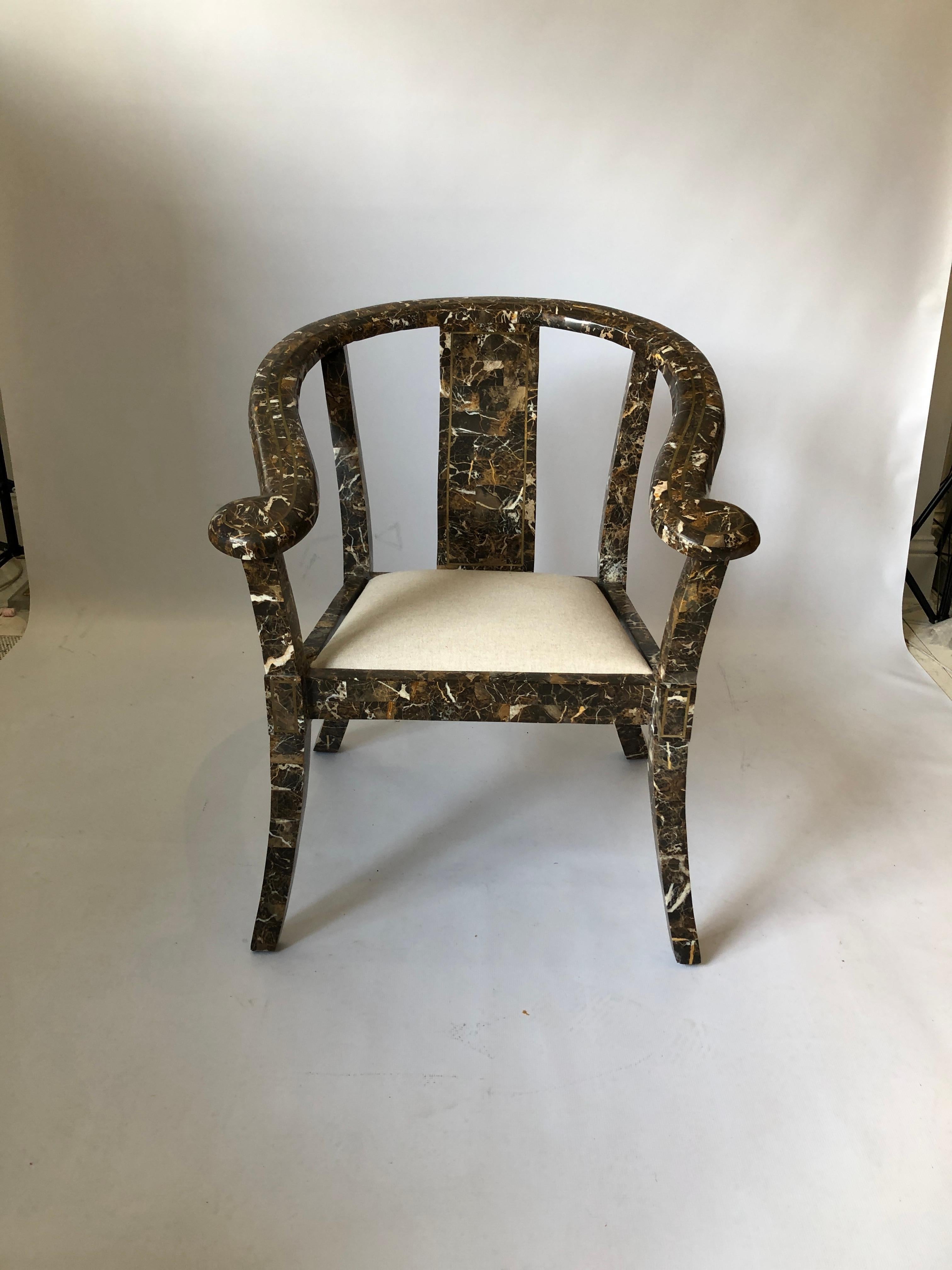 A beautifully 1970s marble carver side chair from Maitland-Smith, the renowned American furniture company. Marble chinoiserie inspired frame with brass inlay and gently curved corners, all finished in a wonderful tessellated black and brown pattern