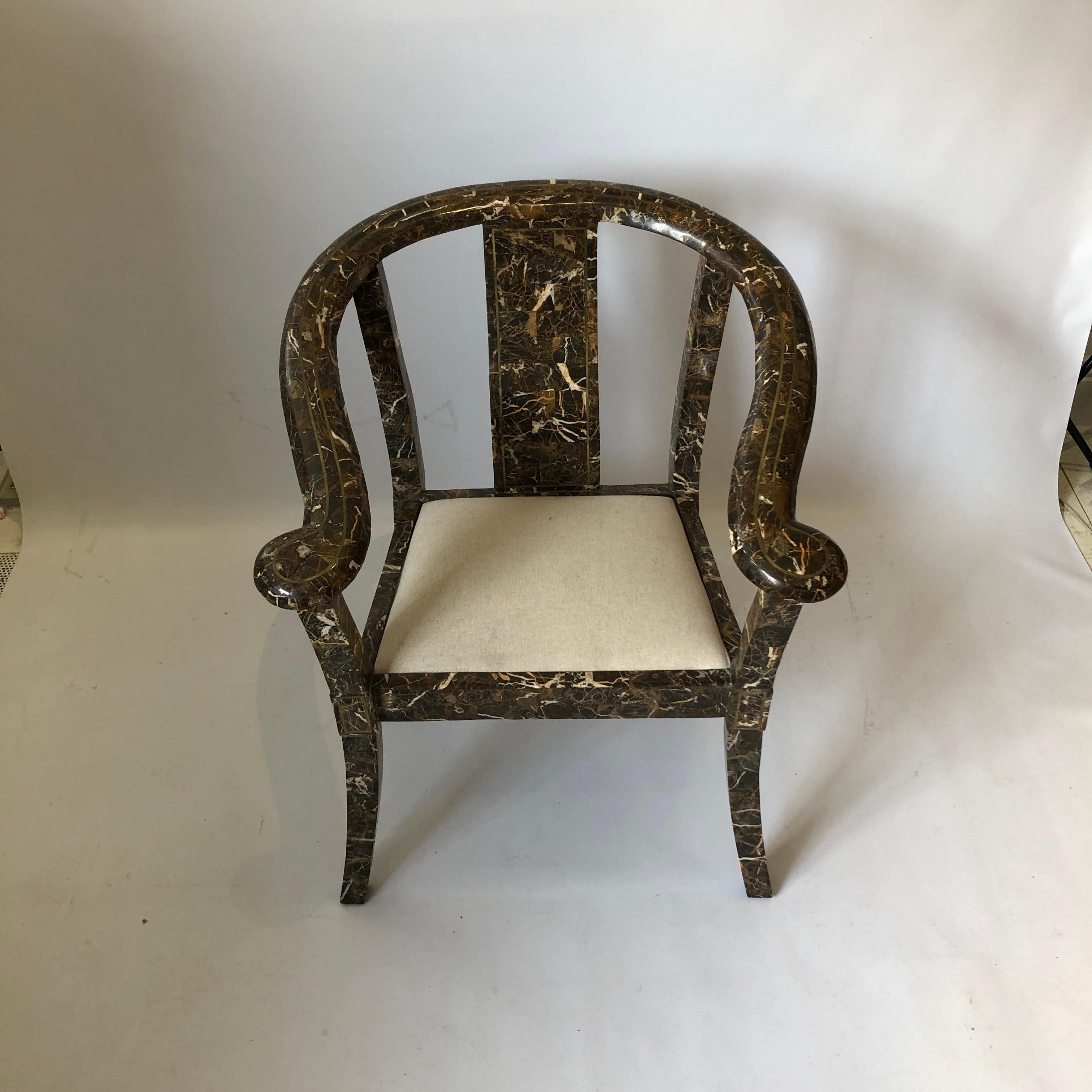 A beautifully 1970s marble carver side chair from Maitland-Smith, the renowned American furniture company. Marble chinoiserie inspired frame with brass inlay and gently curved corners, all finished in a wonderful tessellated black and brown pattern