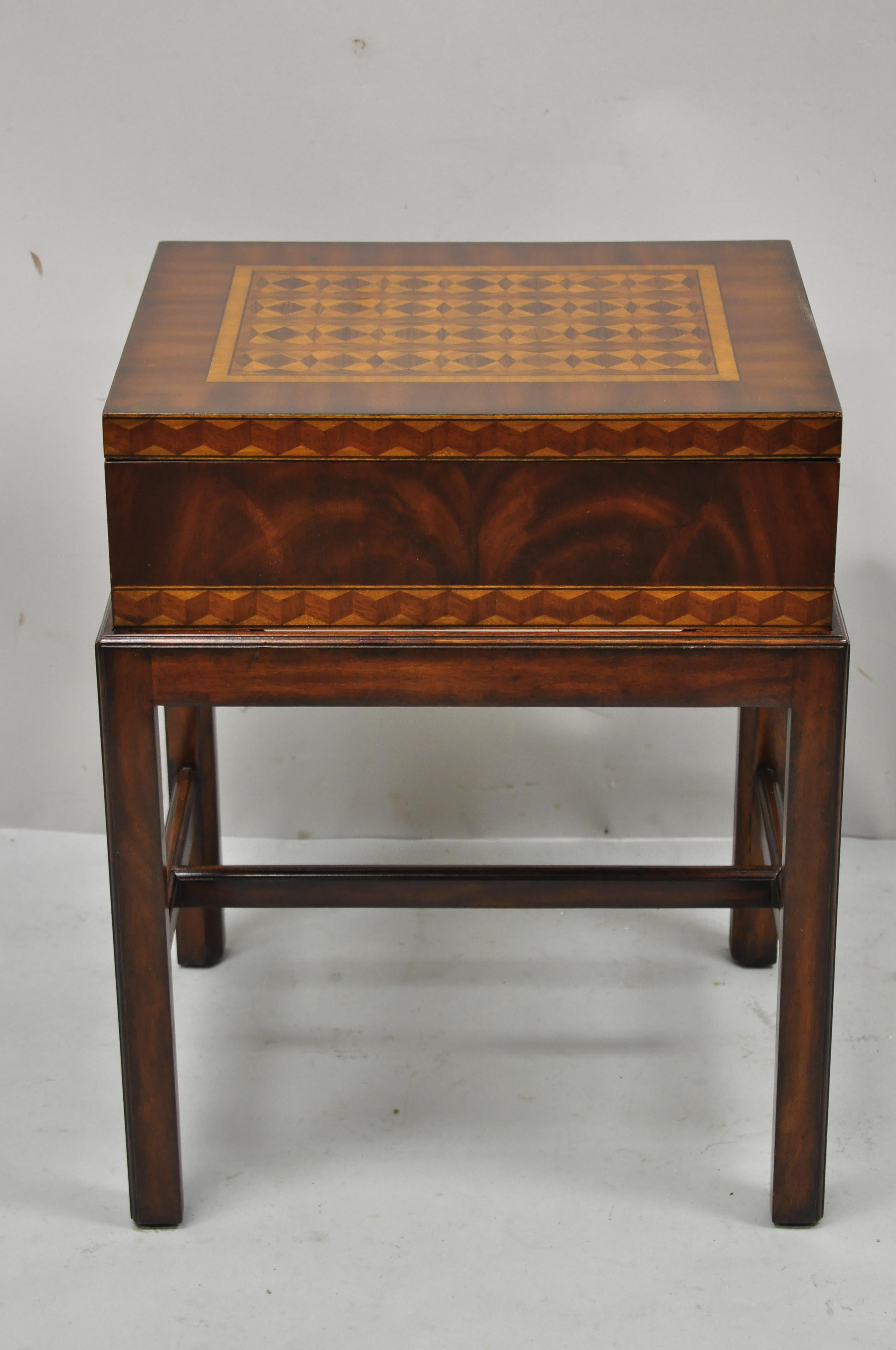 Maitland Smith marquetry inlay campaign style trunk chest side table on base. Item features marquetry inlay throughout, solid brass hardware, stretcher base, solid wood construction, beautiful wood grain, original label, quality craftsmanship, great