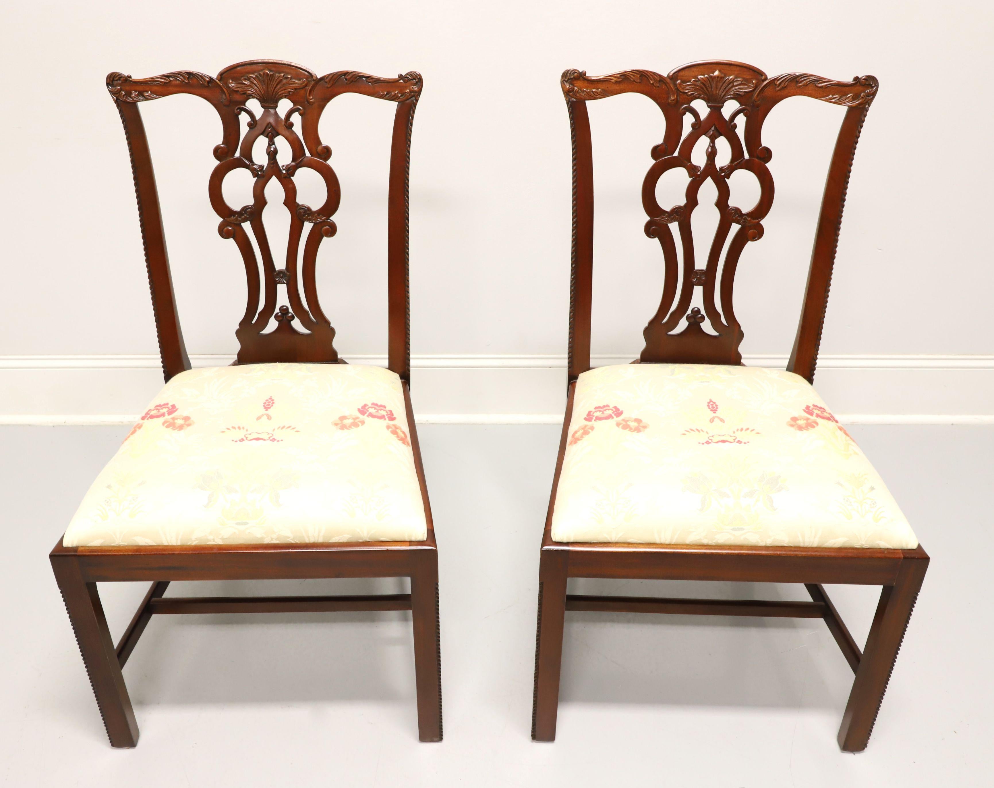 A pair of Chippendale style dining side chairs by Maitland Smith, their Massachusetts. Solid mahogany with decoratively carved crest rail, back rest, carved beading to edge of stiles & edges of the front straight legs with stretchers. Seat