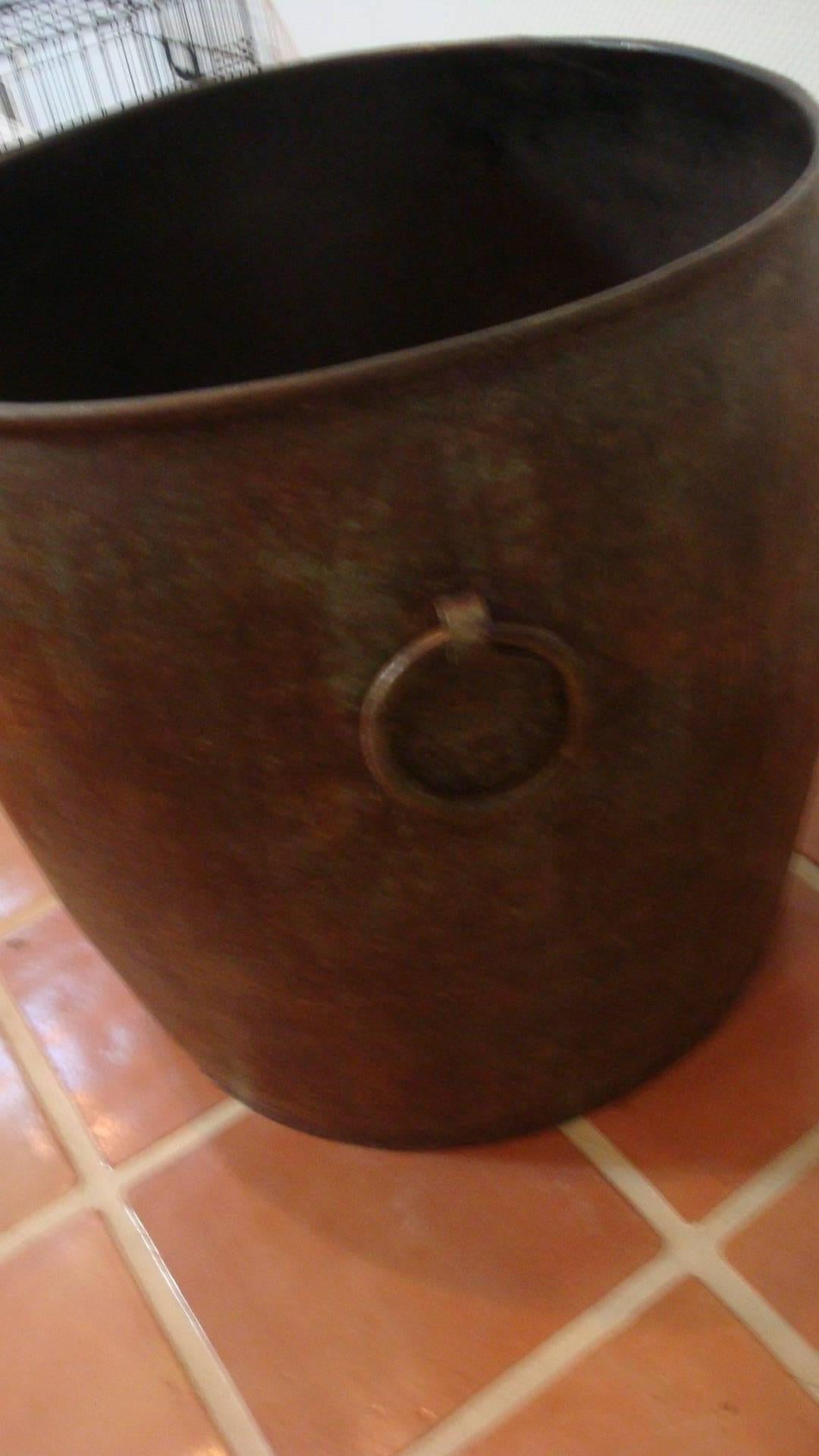 This is an extra large three ringed metal vessel that could be used as planter it was made by Maitland Smith