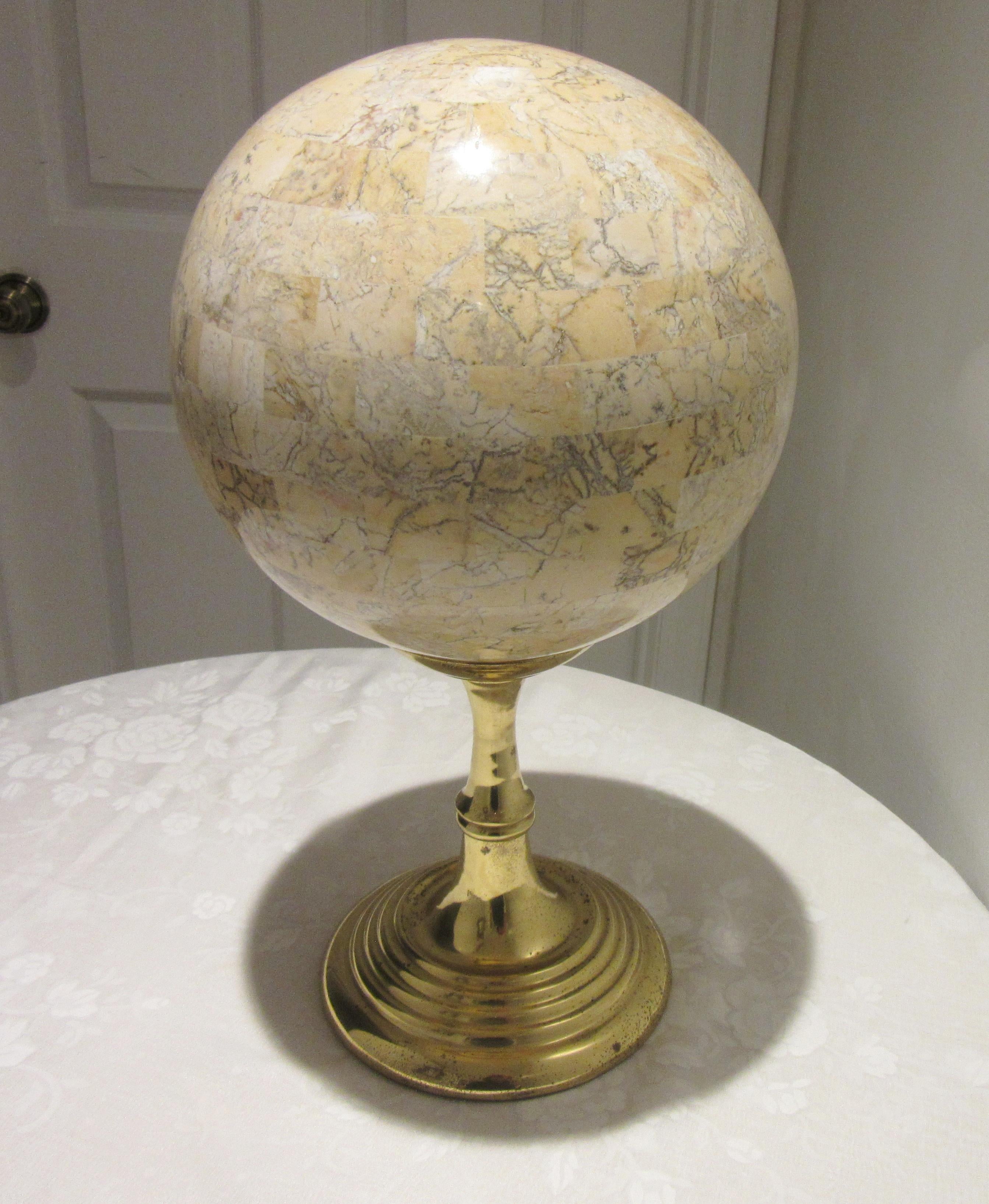 Mid-Century Modern Maitland-Smith large travertine tessellated sphere on a brass stand. The piece is marked on the bottom of the stand and the sphere. The entire piece measures 10” deep and wide, 17” high. The stand by itself measures 7.5” deep and
