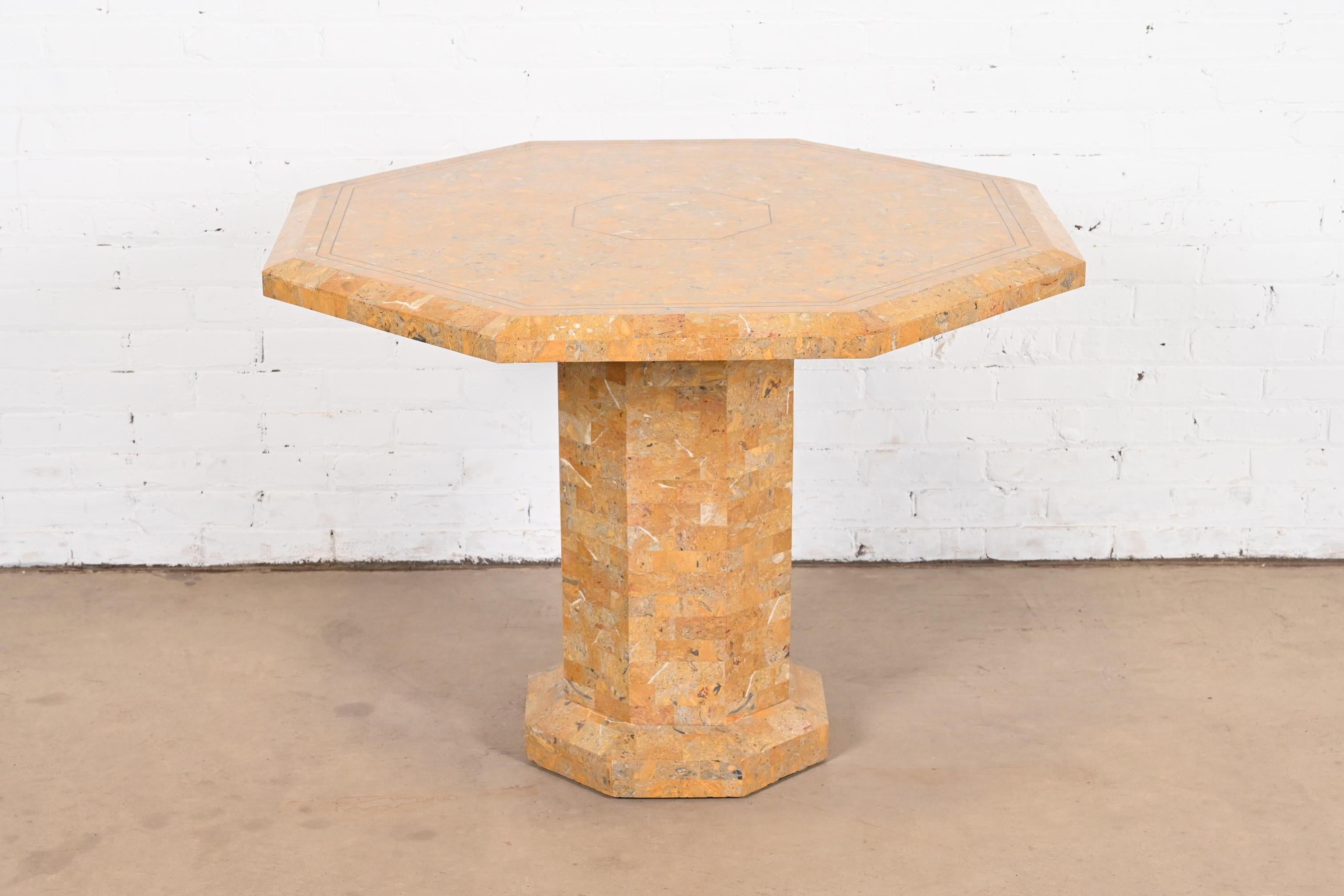 An exceptional Modern pedestal dining table or center table

By Maitland Smith

Philippines, Circa 1980s

Gorgeous tessellated marble, with inlaid brass.

Measures: 40.5