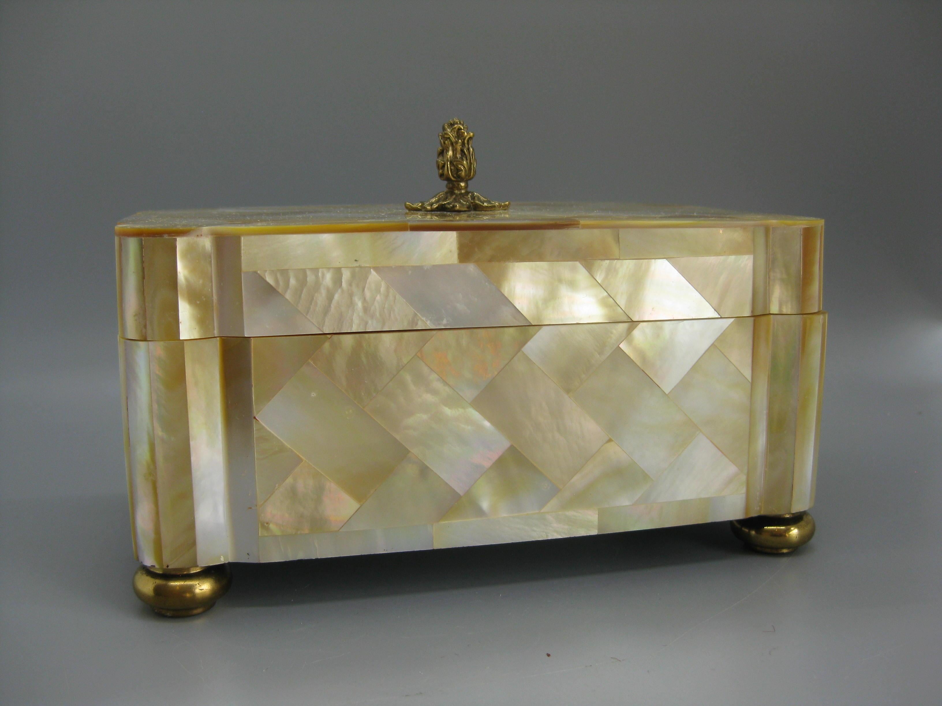 We are offering a beautiful elegant natural mother of pearl over wood tessellated mosaic decorative stash box designed by Maitland Smith. This box does not have the original tag on the inside, but guaranteed designed by Maitland Smith. The box has