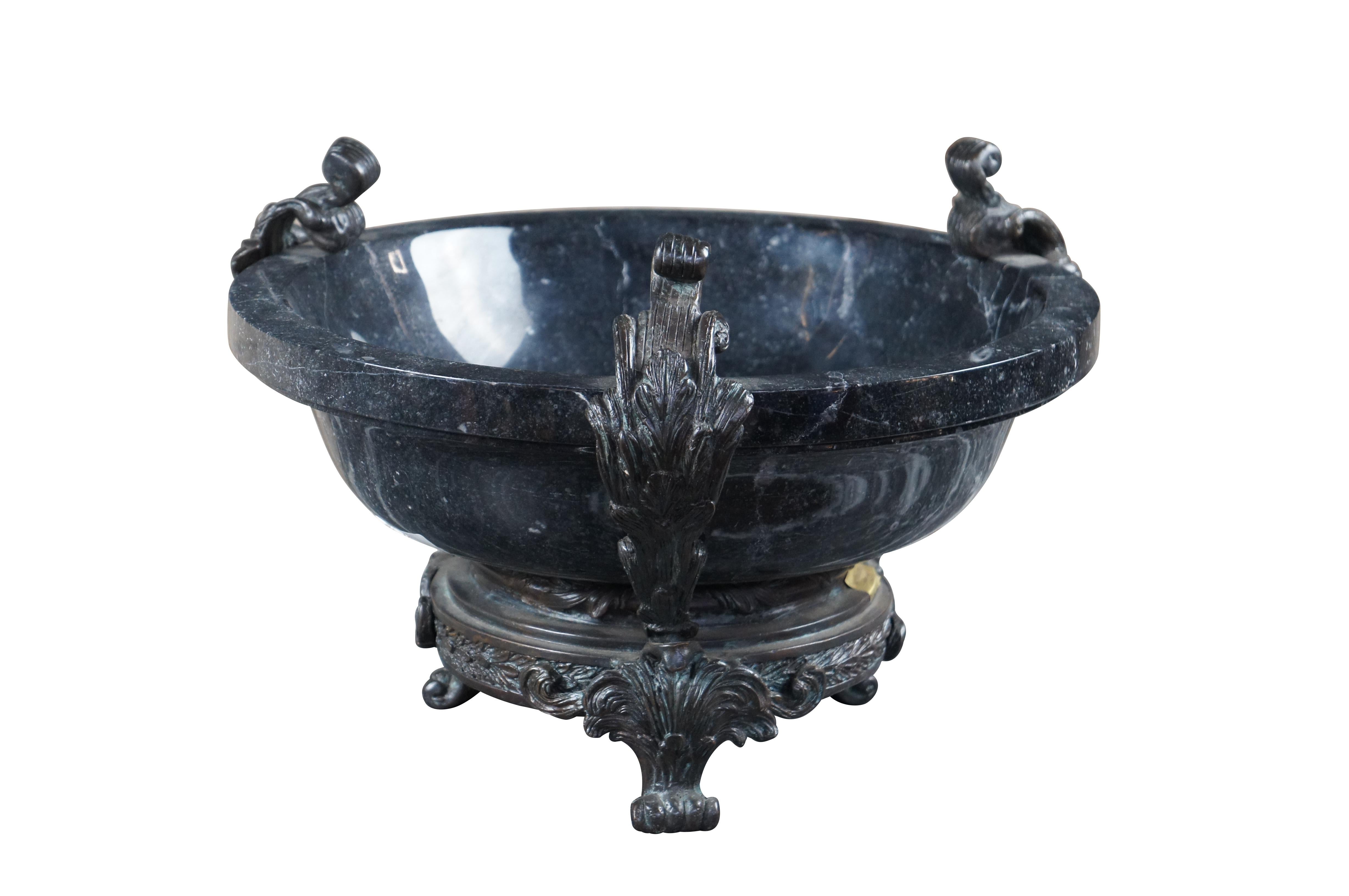 An impressive black marble and brass Tazza by Maitland Smith, circa 1990s. Features a marble bowl on a brass footed stand with neoclassical relief. Makers mark along side of base.

Dimensions:
16.5 x 16.5