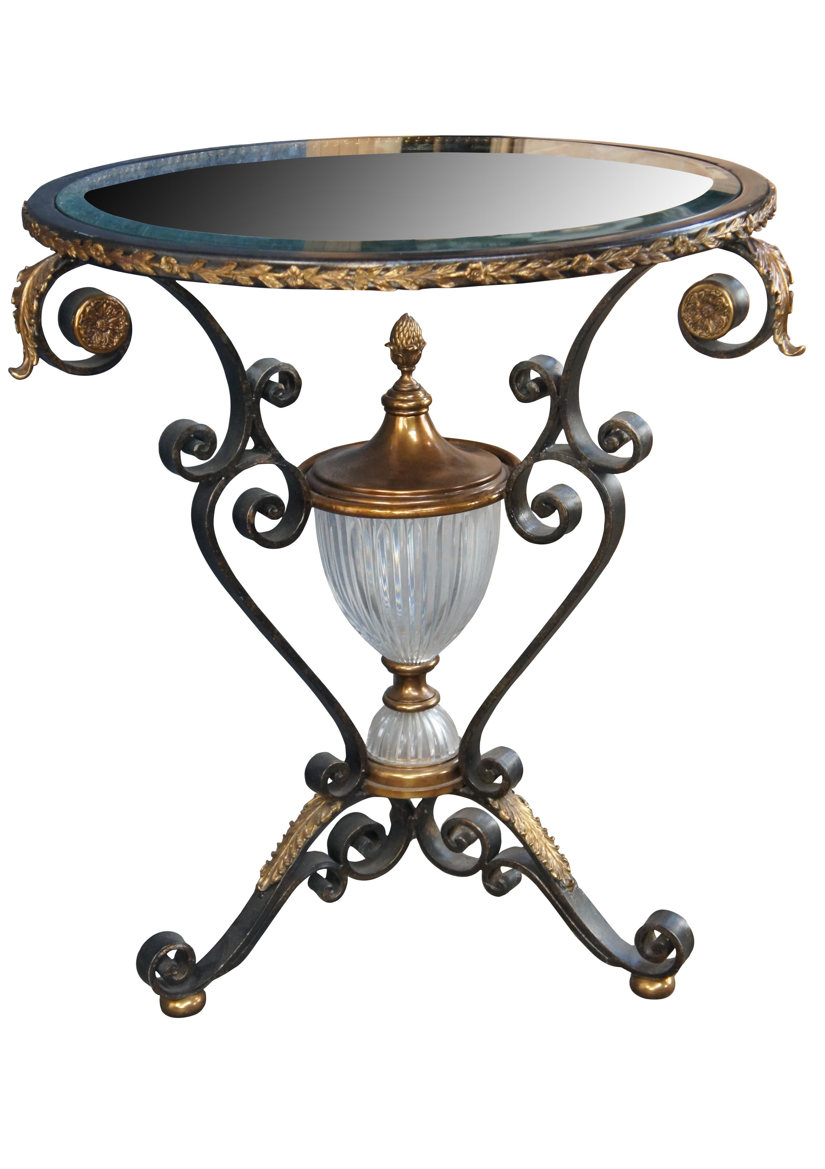 Late 20th Century Maitland Smith Side, Accent or Center Table. Drawing inspiration from French Louis XV & Italian Neoclassical styling. Features a round top over scrolled iron frame with applied brass ormolu and tripod base over gold bun feet.. The
