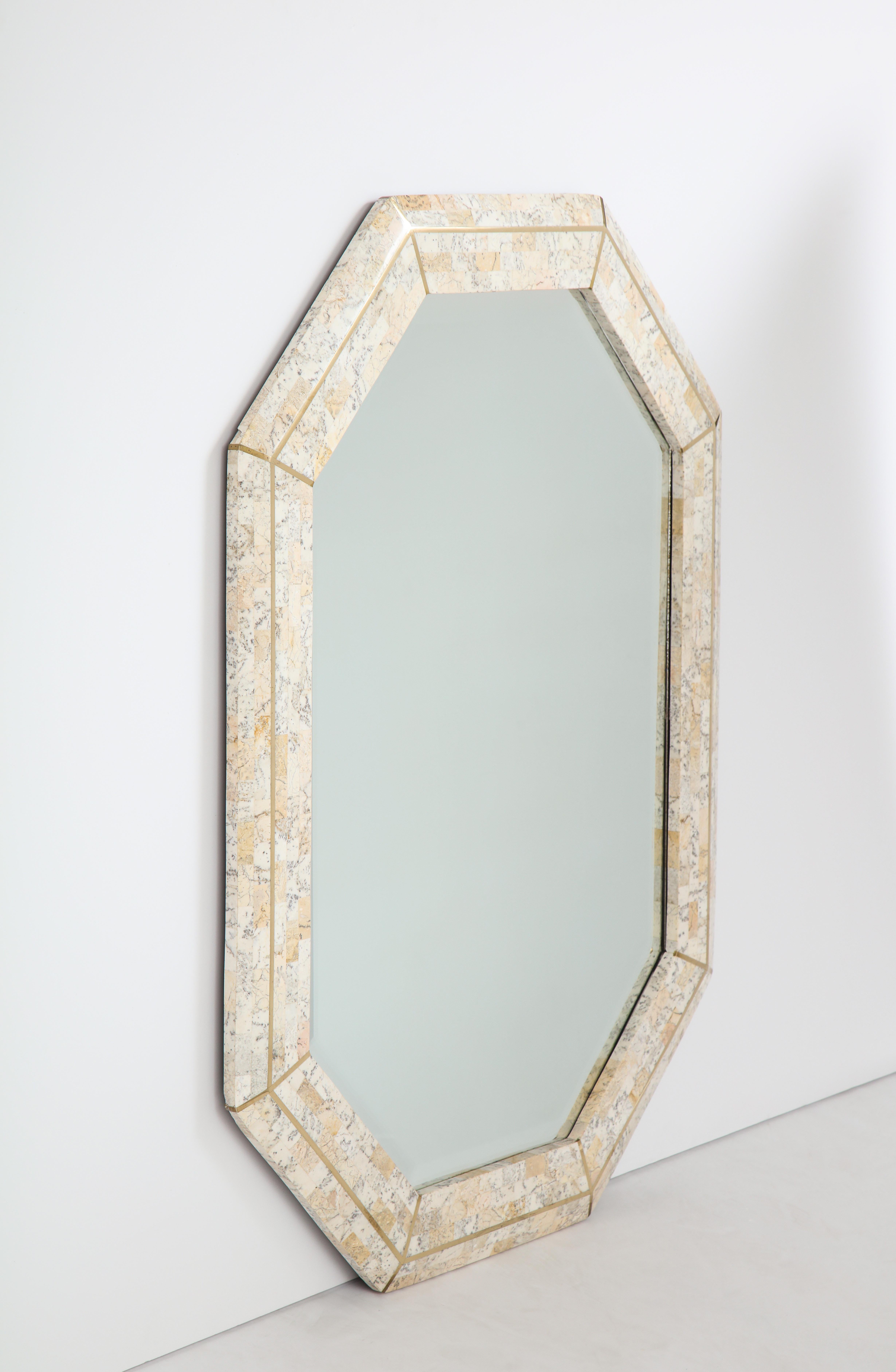 Maitland Smith octagonal tessellated stone and inlaid brass mirror 
Philippines, circa 1980.
Size: 40 1/2