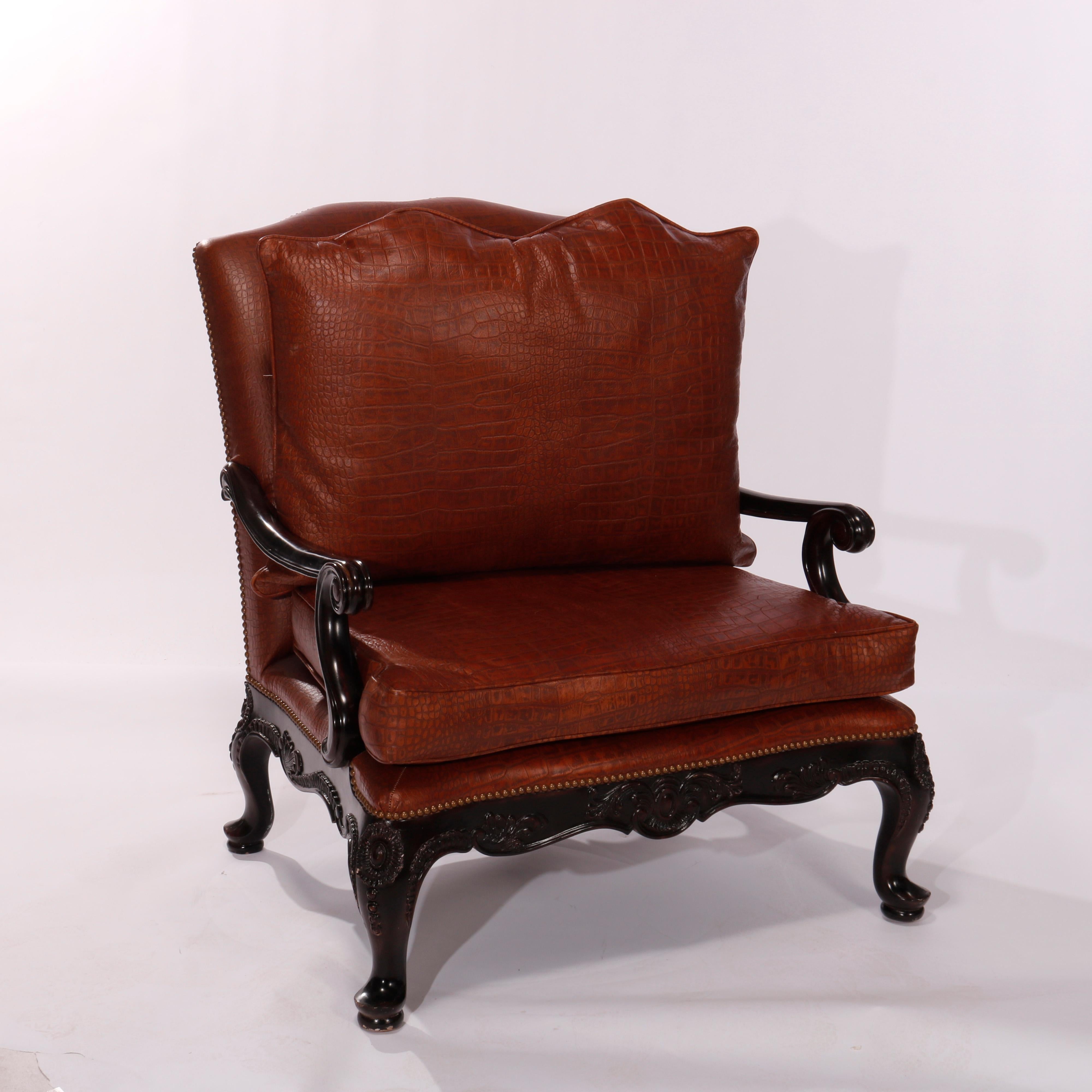 A large armchair by Maitland Smith offers leather upholstery in alligator skin patter with shaped back over walnut frame raised on carved cabriole legs, maker label as photographed, 20th century.

Measures - 41.5''H X 38.5''W X 39.75''D; seat height