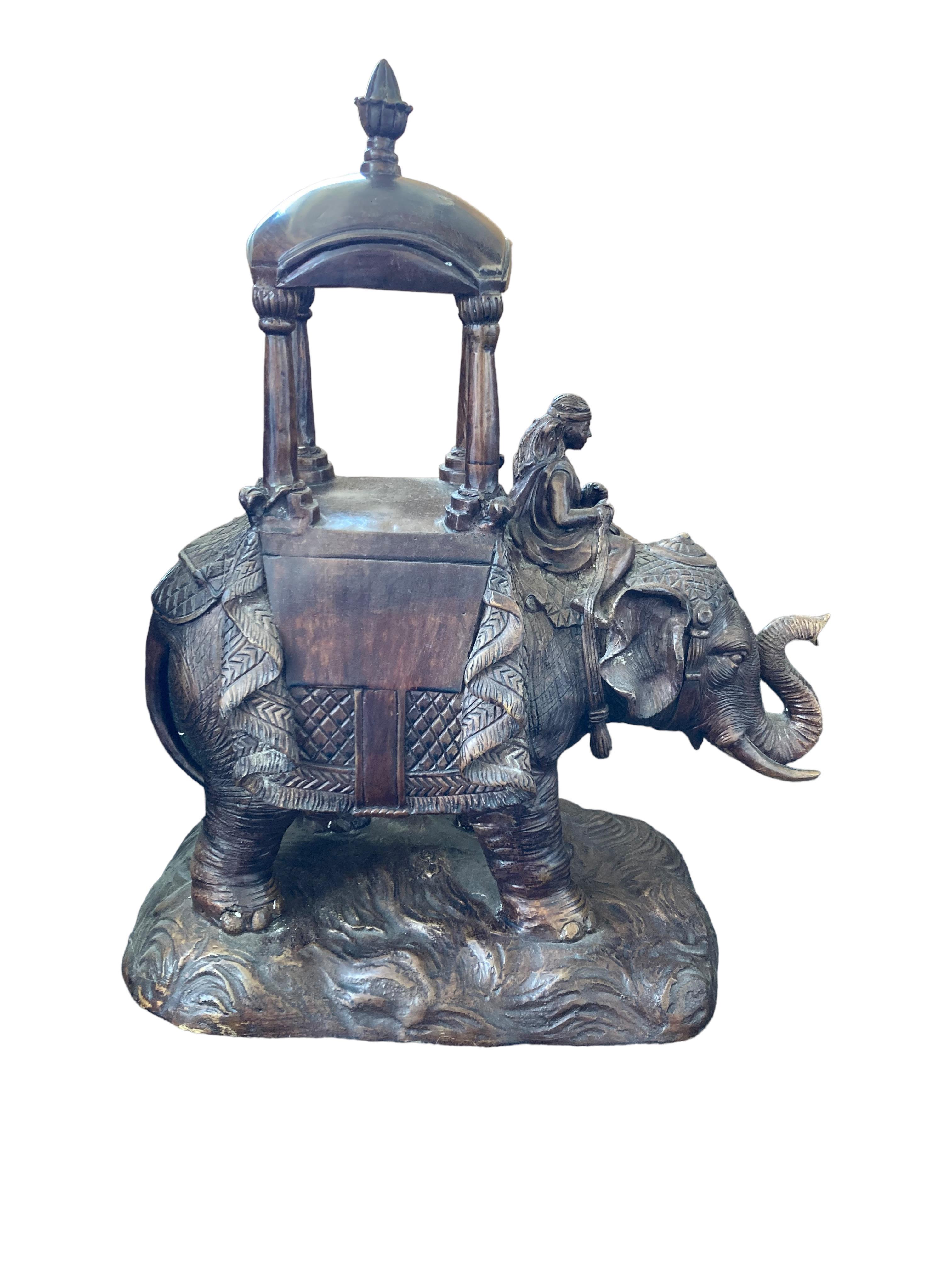 This Maitland Smith Parade Elephant With Mahout was cast in a dark bronze. Mahouts came from generations of elephant keeping experience and retained their elephant throughout its working life. They would often ride on a howdah placed on the back of