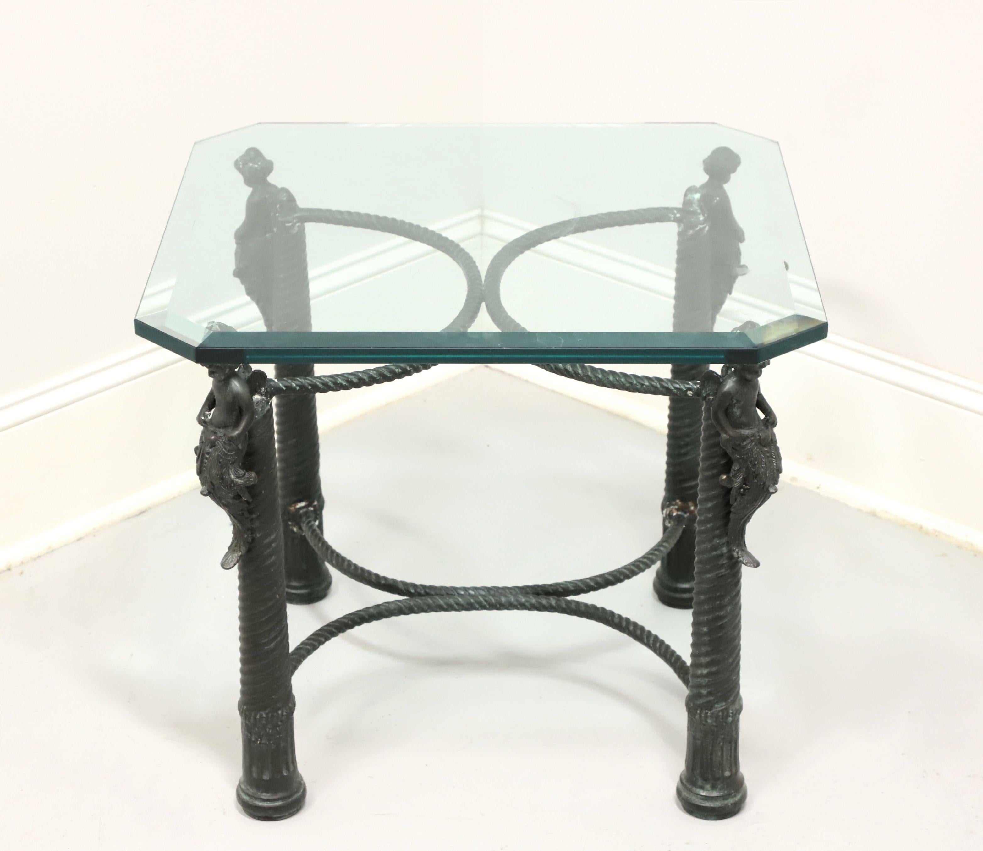 A Nautical inspired mermen cocktail table by Maitland Smith. Solid bronze patinated to a green/blue color, glass top, nautical style rope twist legs and stretchers. Features four sculpted mermen at top of each corner appearing to hold the glass top.