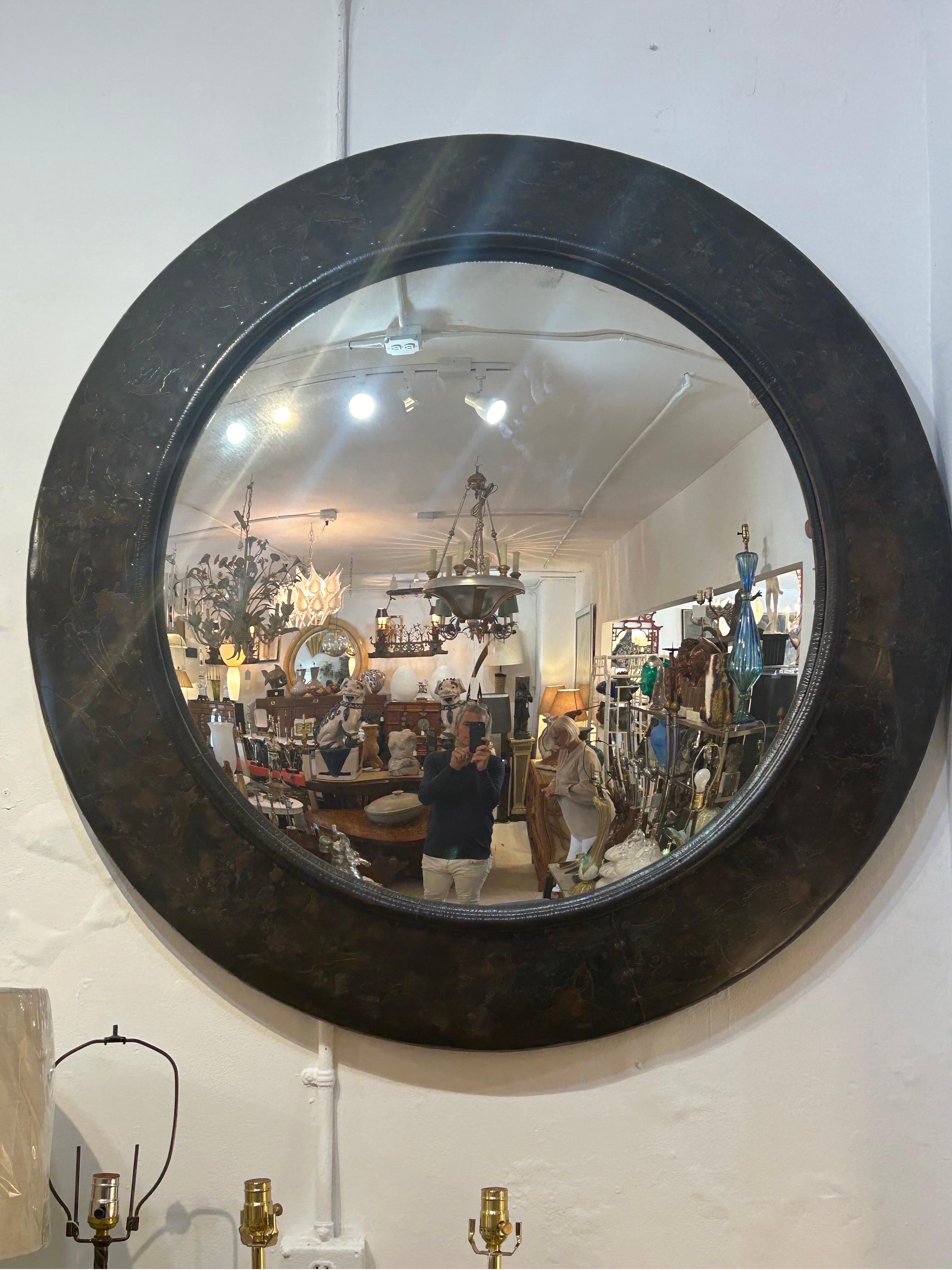 A large rare hammered patchwork metal frame convex mirror… With metal patchwork connected by small nails high-quality by Maitland Smith…reminiscent of Paul Evans..