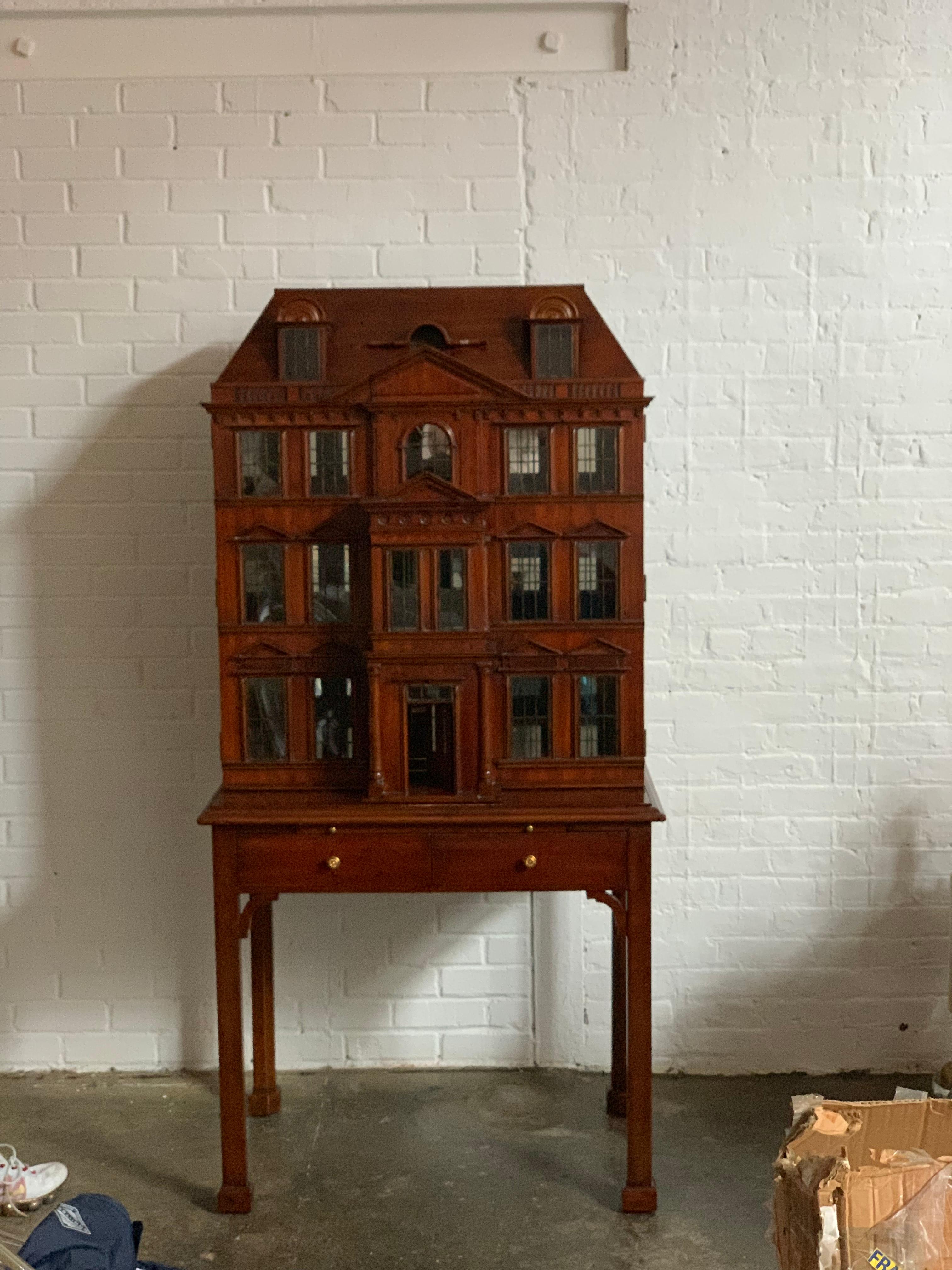 Maitland Smith Iconic postmodern Victorian Dollhouse bar cabinet cupboard. Incredible detail with glass windows, copper mullions and hand carved architectural details. Heavy glass interior shelf. Embossed leather slide. Illuminated with dimmer!
 