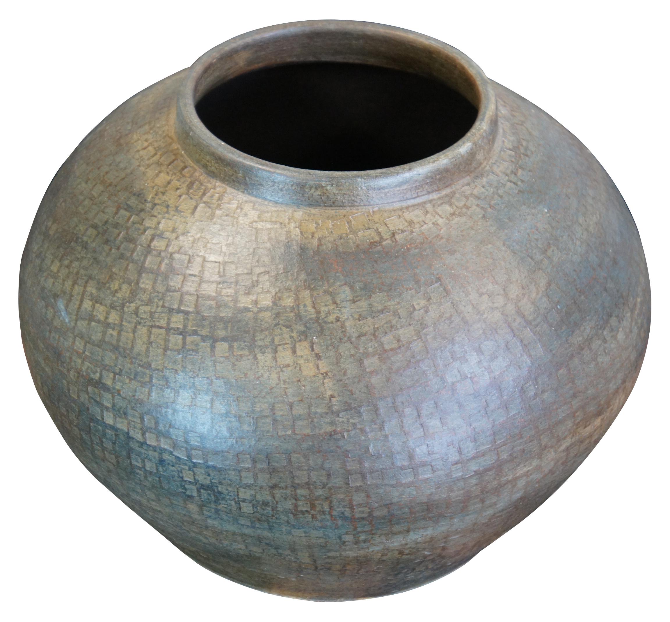 Maitland Smith green ceramic vase. Raku style with a squatty form and unique square imprint pattern. Measure: 14