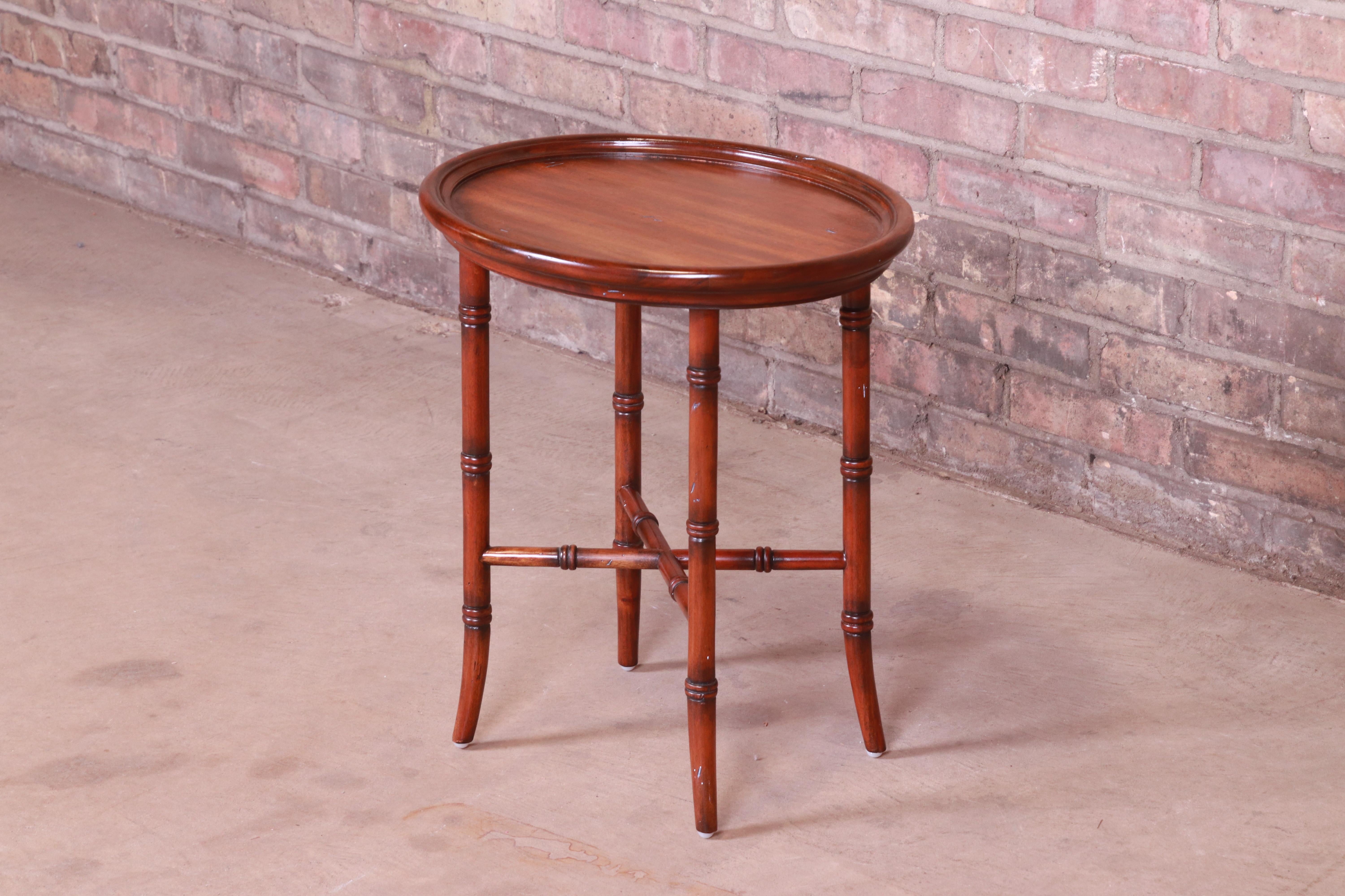 A gorgeous Regency style faux bamboo mahogany side table or tea table

By Maitland Smith

Late 20th century

Measures: 18