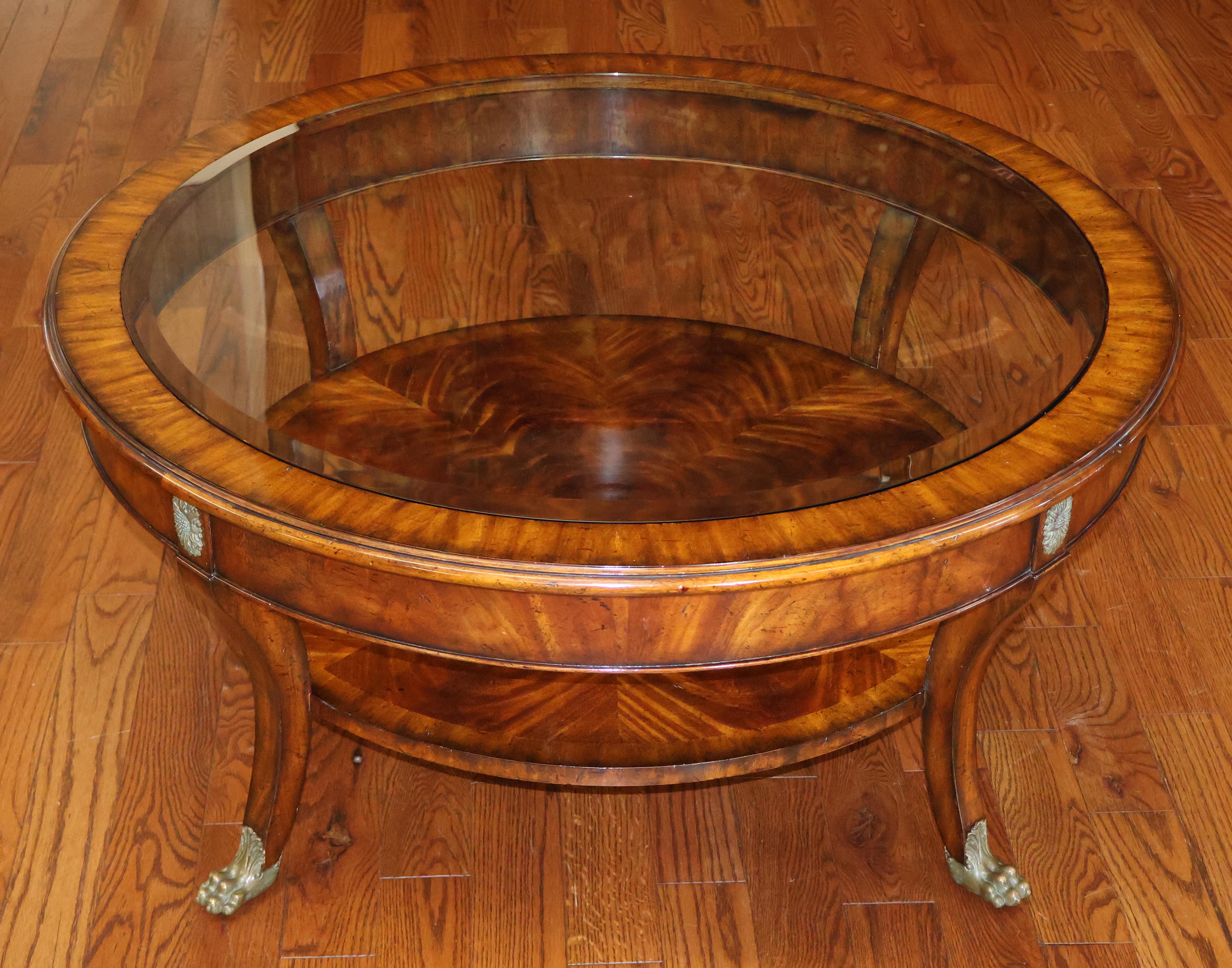 Maitland Smith Regency Style Mahogany Round Glass Top Cocktail Coffee Table
Measures
18 1/4 In H x 40 1/4 Diam

Nice round coffee table made by Maitland Smith. some scratches to glass photographed. Wood in excellent shape.