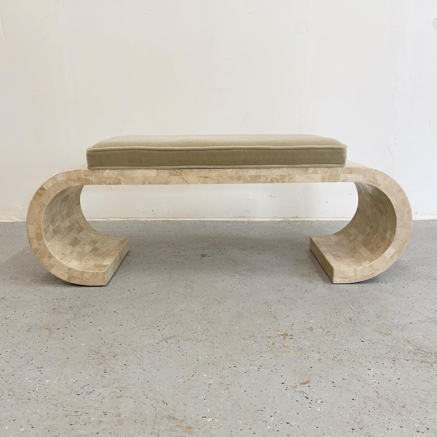 An outstanding Karl Springer style scroll bench encased in tessellated stone with mohair upholstery to the cushioned seat. Wonderful natural tones and organic shape to this Hollywood Regency bench, newly upholstered.