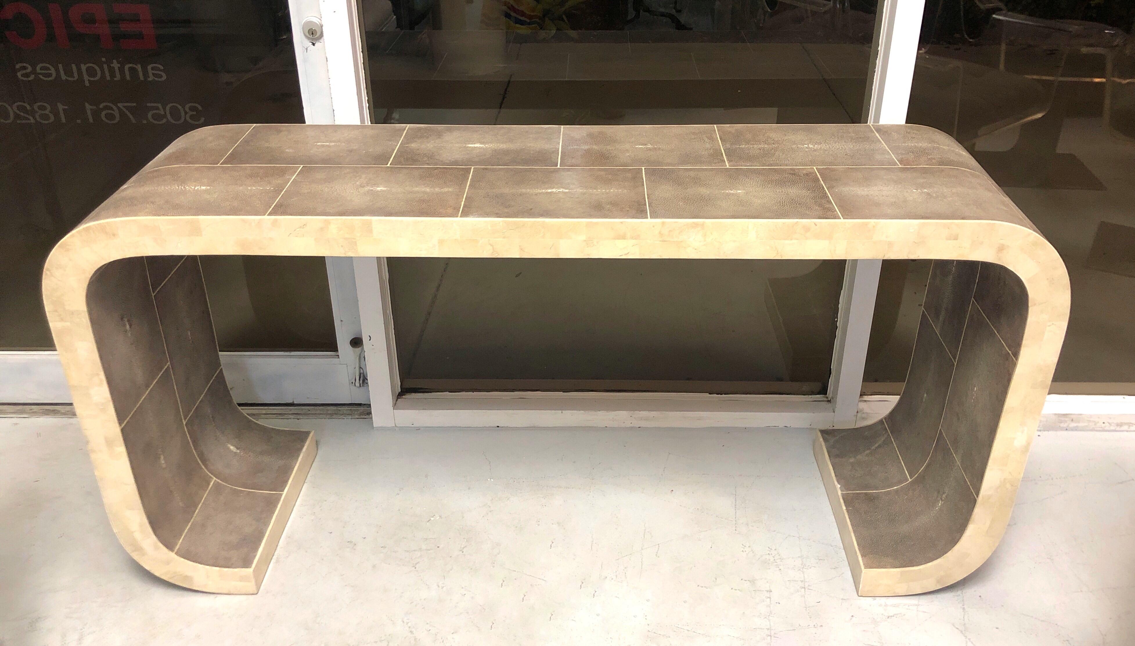 A shagreen console table by Maitland-Smith. Great proportions and design. The sides are covered in tessellated marble. Signed with brass tag on verso of top.