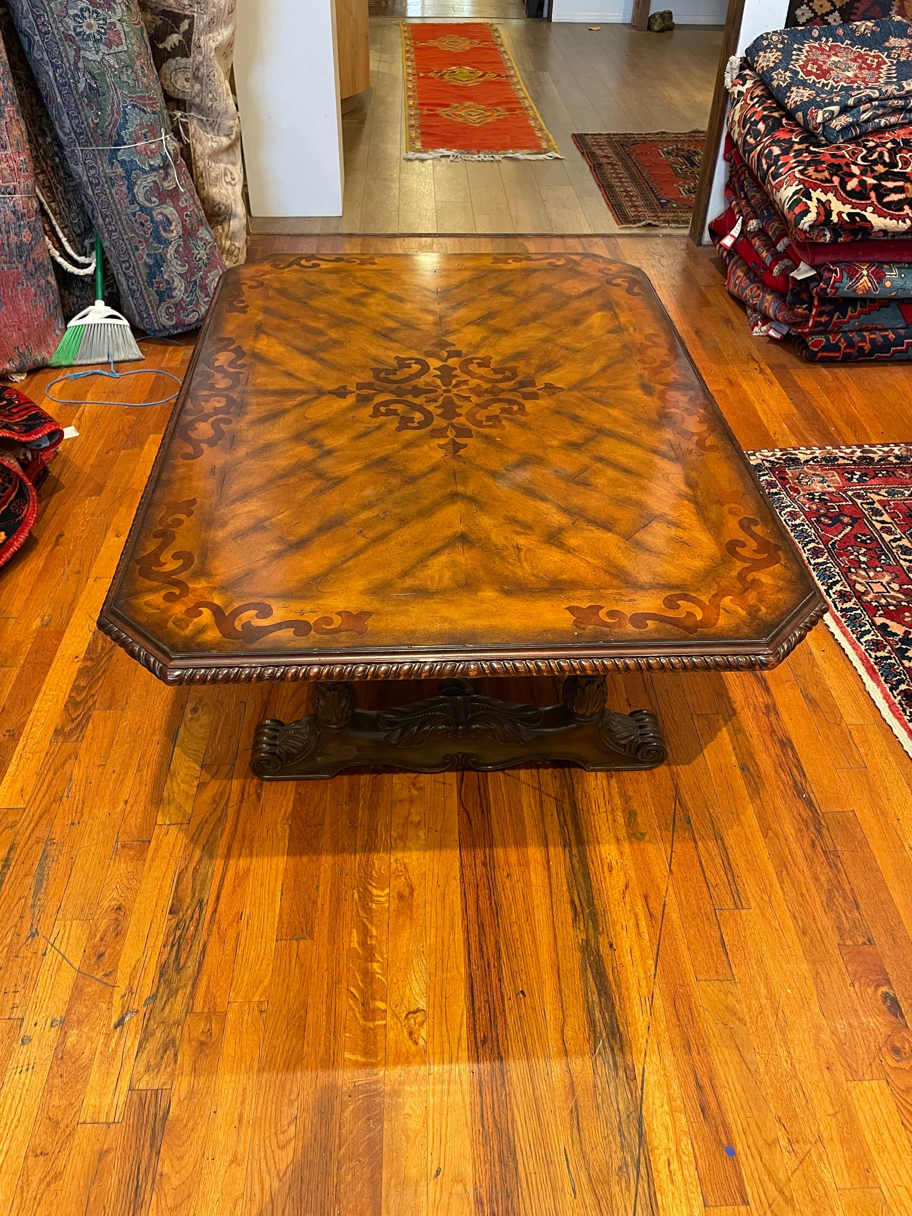 Beautiful inlaid coffee table by Maitland Smith, nice original condition circa 1990s nice medallion legs and carved wood edge.