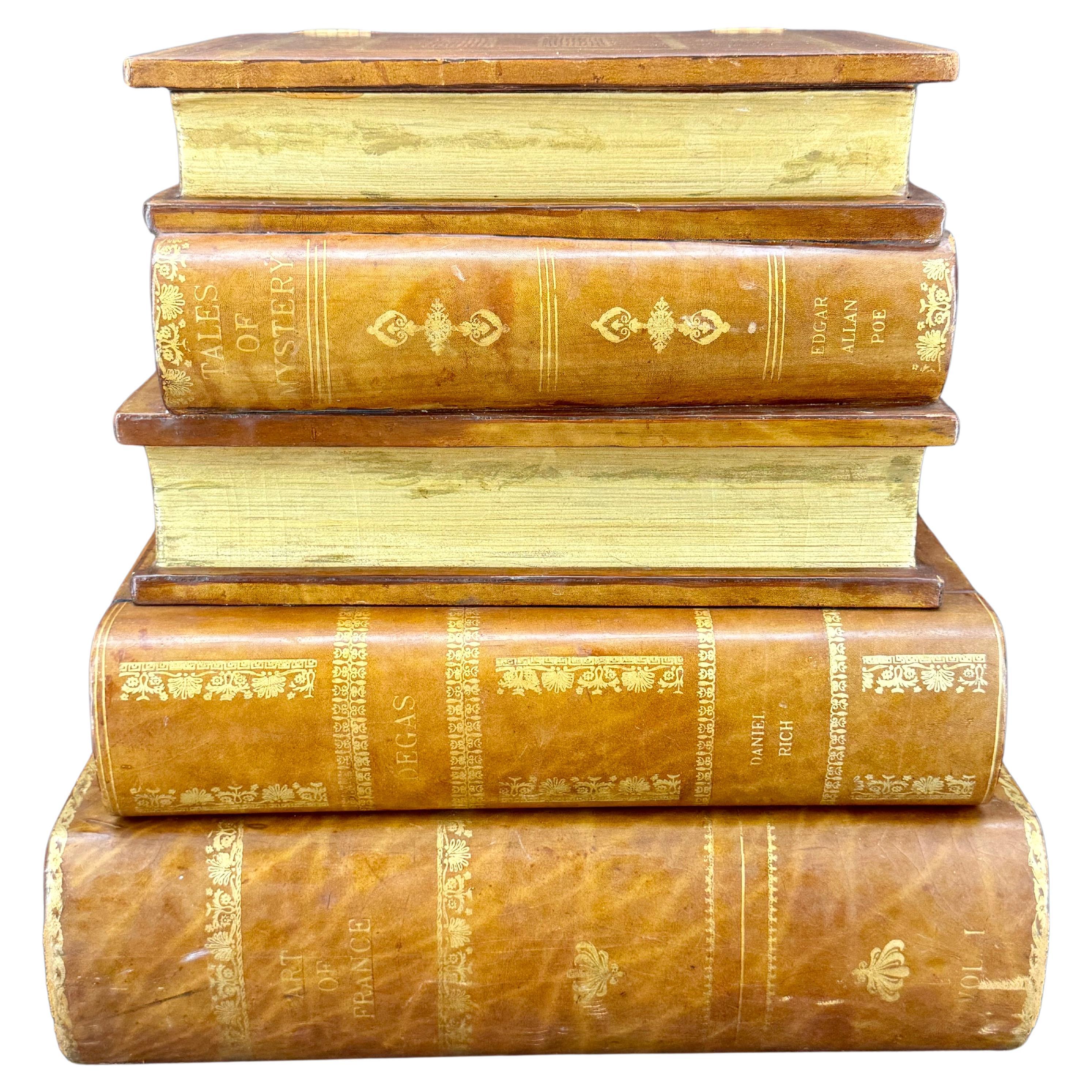 Realistic large fine gilt tooled leather-bound library books in different sizes have been crafted on wood to make this end or side table. 
There are gilt edges throughout with one drawer as well as storage at the top has been lined with marbled