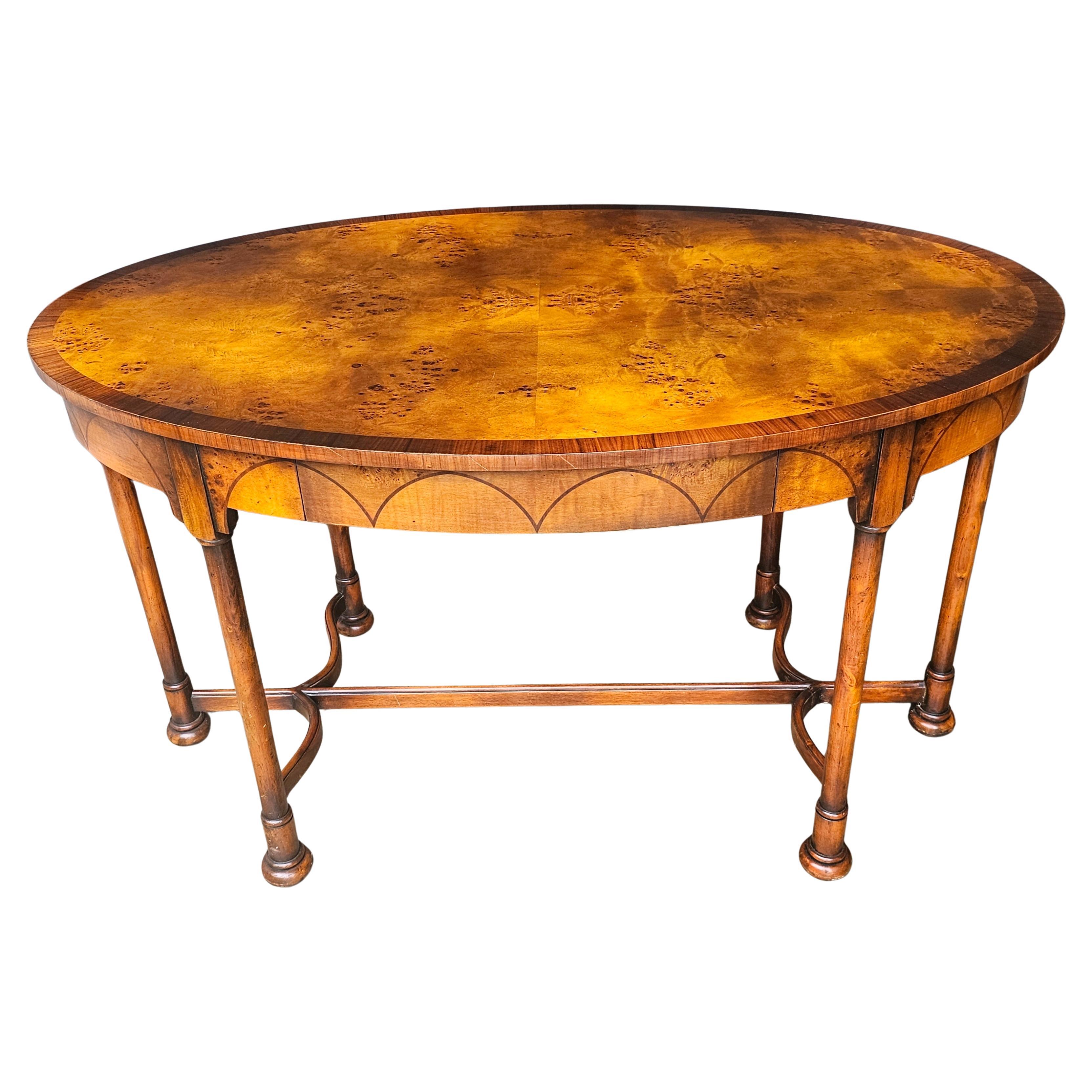 Theodore Alexander Mixed Fruitwoods Stretcher Library Table with Single Drawer and leather with Two Stenciled Leather top Pull Out Trays. Will make a great Hall or center Table as well.
Measures 52