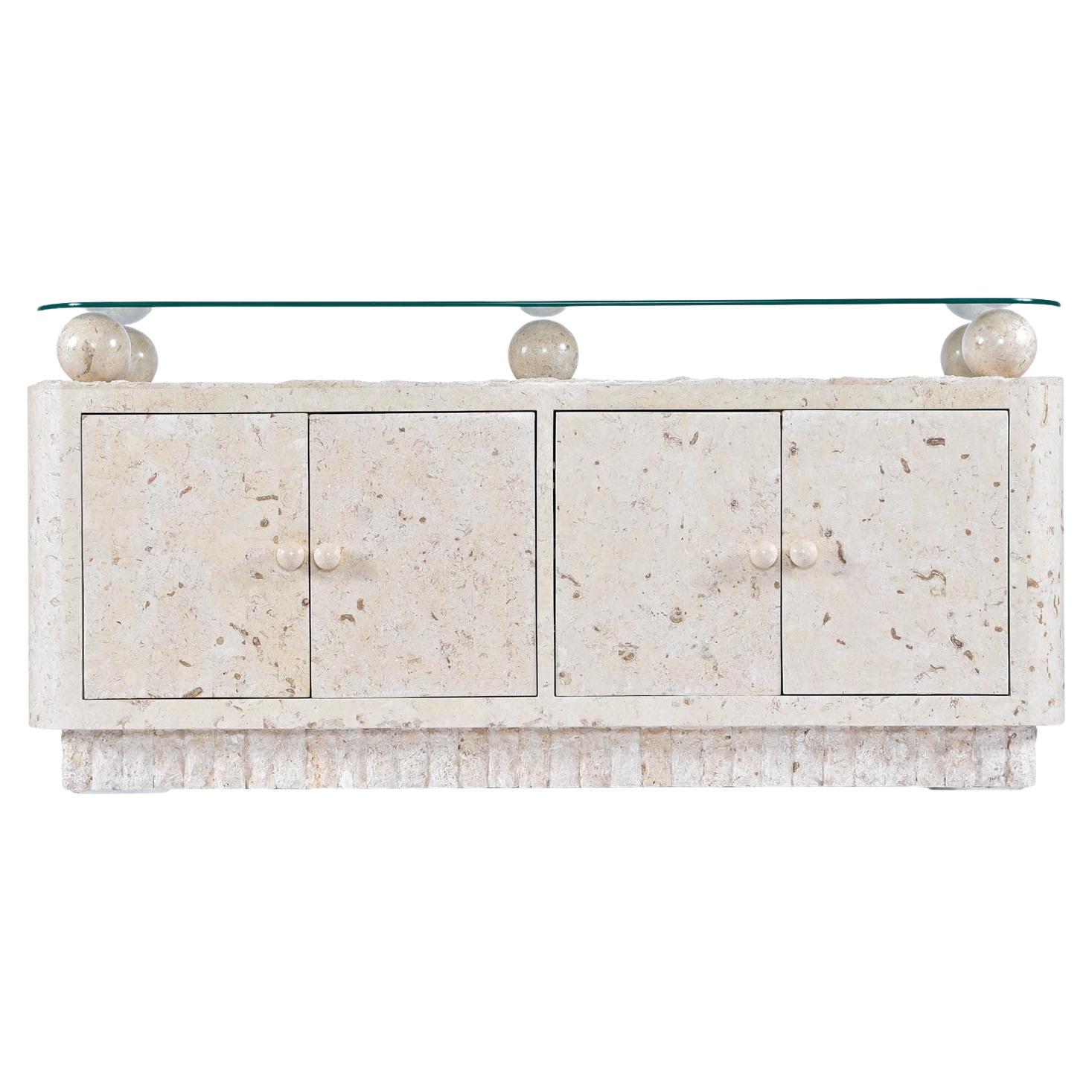 Mactan tessellated stone buffet / credenza designed in the style of Maitland-Smith; attributed to Magnussen Ponte. The five massive, smooth, tessellated stone orbs that sit atop the coral, feature exotically marbled earth tone veins. The orbs act as
