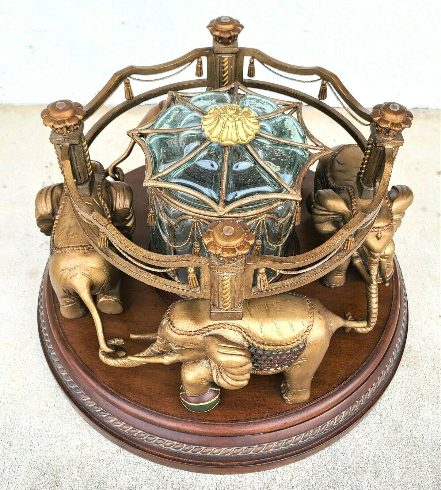 Late 20th Century Maitland Smith Style Rotating Elephant Carousel Glass Top Coffee Cocktail Table