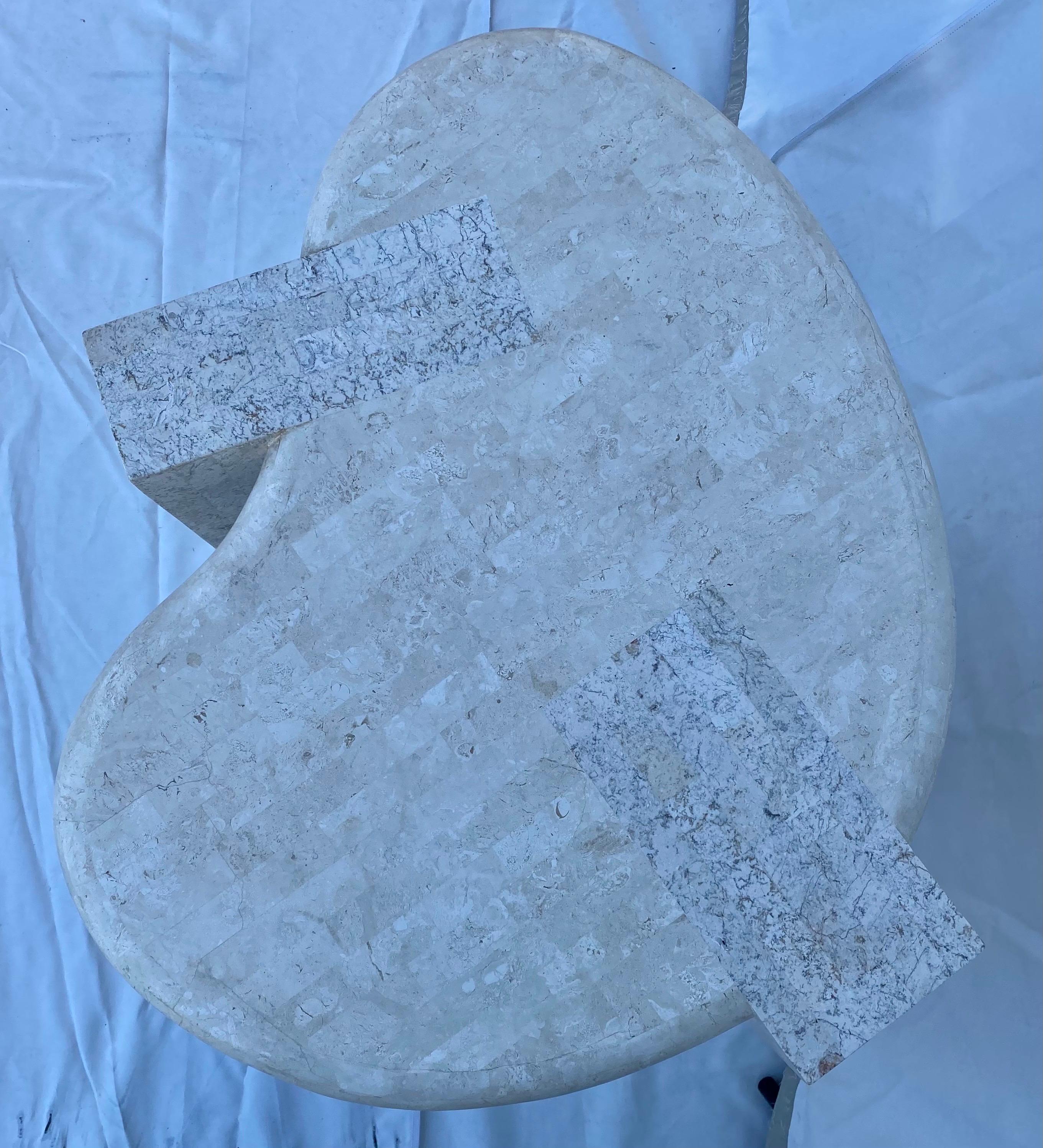 Mid-Century Modern Maitland Smith style tessellated stone biomorphic shaped end or side table. This undulating and organic accent table features rolled edges and a beautifully smooth and polished tessellated stone throughout. The sculptural free