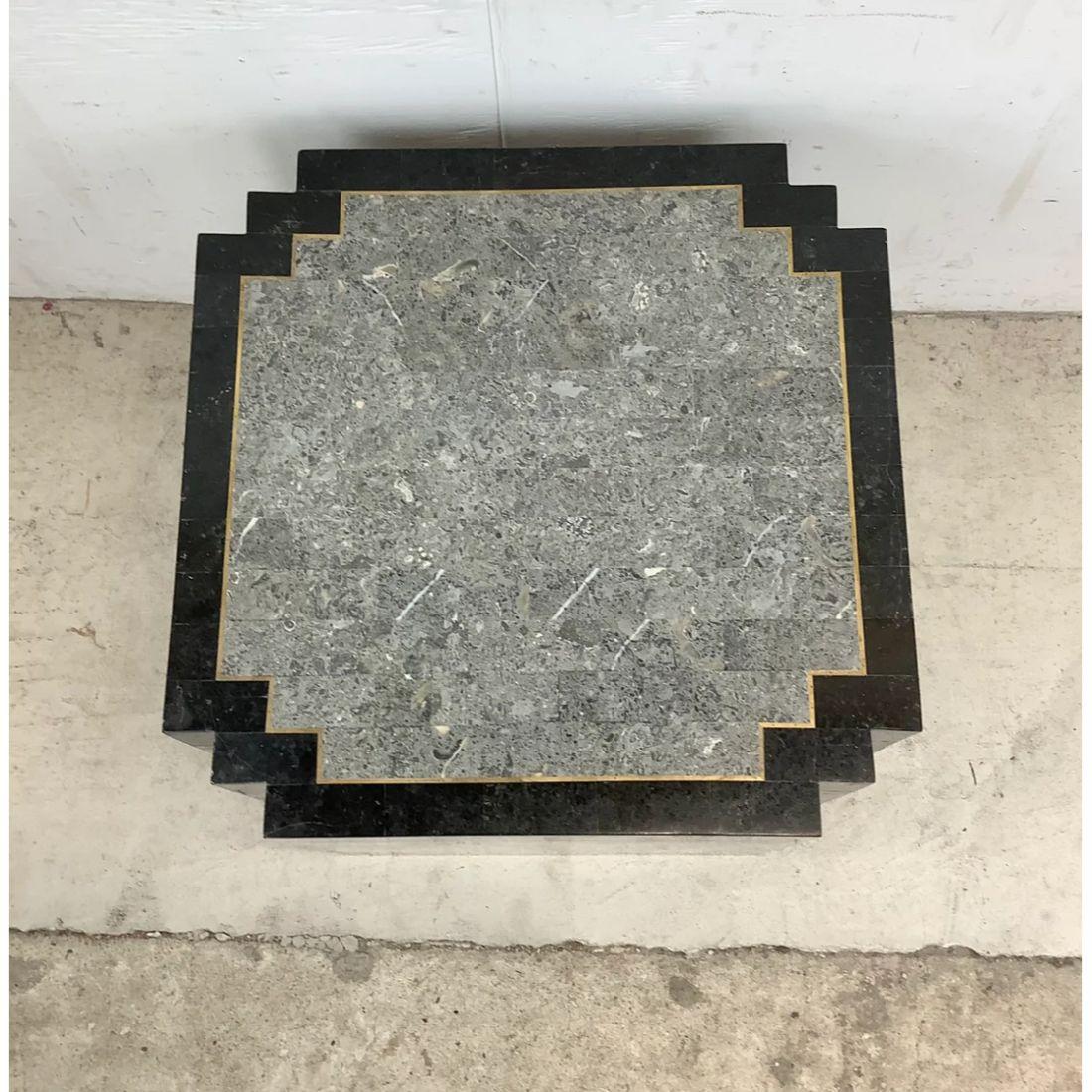 This vintage modern side table makes an eye catching end table or lamp table in any setting, its unique shape, low-profile, and tessellated stone finish add to the striking appeal of this Maitland-Smith style table. Mixed tone stone finish with