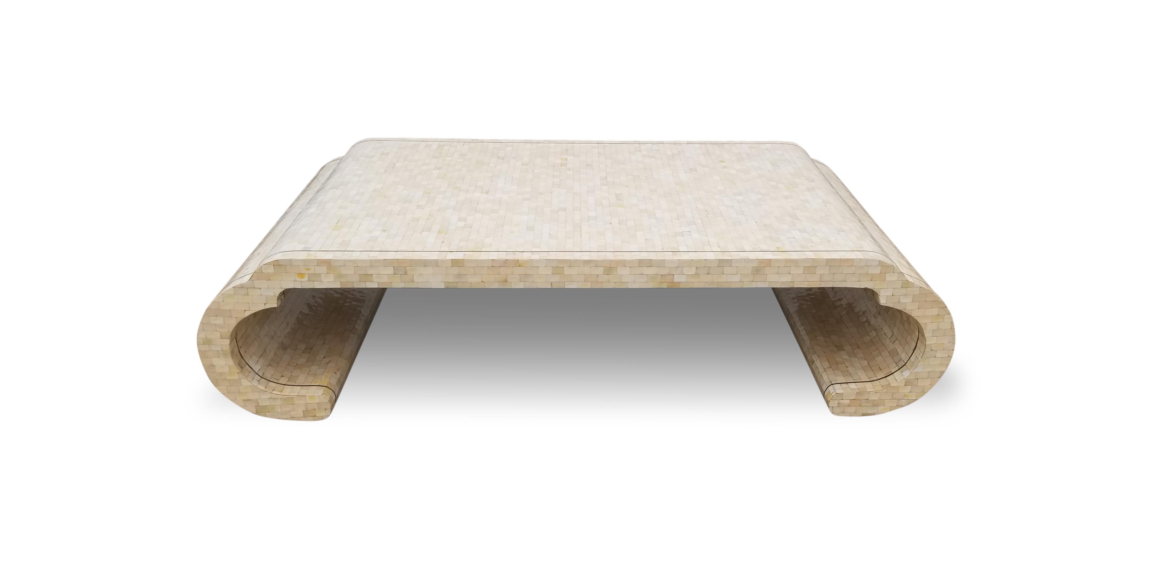 Maitland Smith tesselated bone coffee table with brass edge detail.