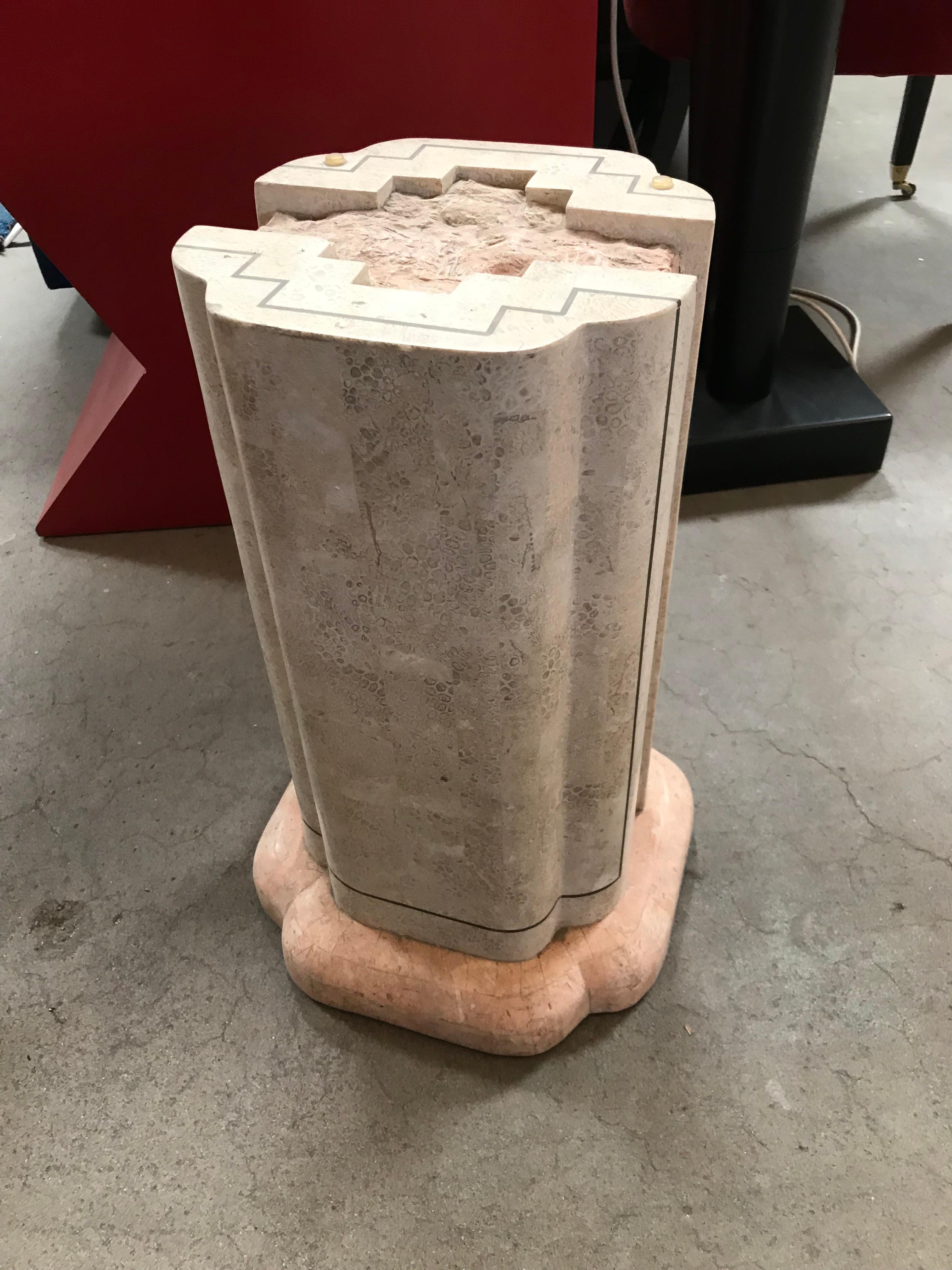 Tesselated marble pedestal by Maitland-Smith. Beautiful combination of a patterned neutral colored and a light pink marble. The centre of the piece is filled with rough pink marble pieces.
The glass top seems a little bit too big for the base.

