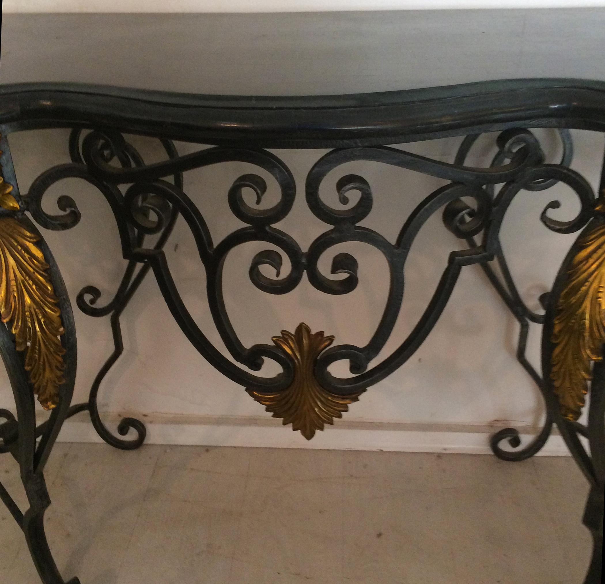 Large Wrought iron with brass Tessellated black marble-top table. Maitland Smith from the 1980s. In very good condition good clean finish no damage to tessellated top.