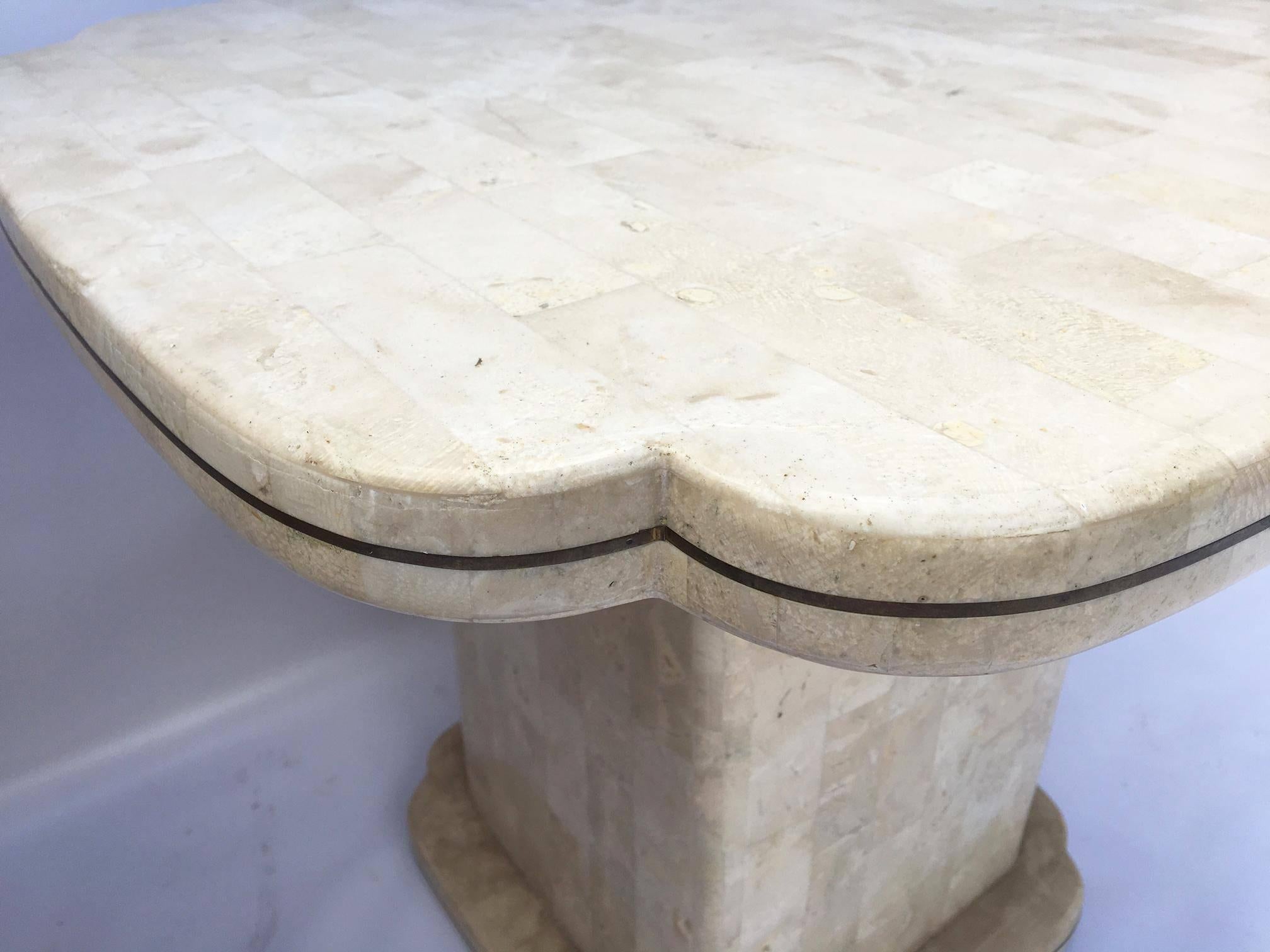 Pair of Maitland-Smith end tables feature a fossil stone veneer and brass inlay. Excellent condition other than small area of missing stone on rear of each table.
As always, all reasonable offers will be considered.