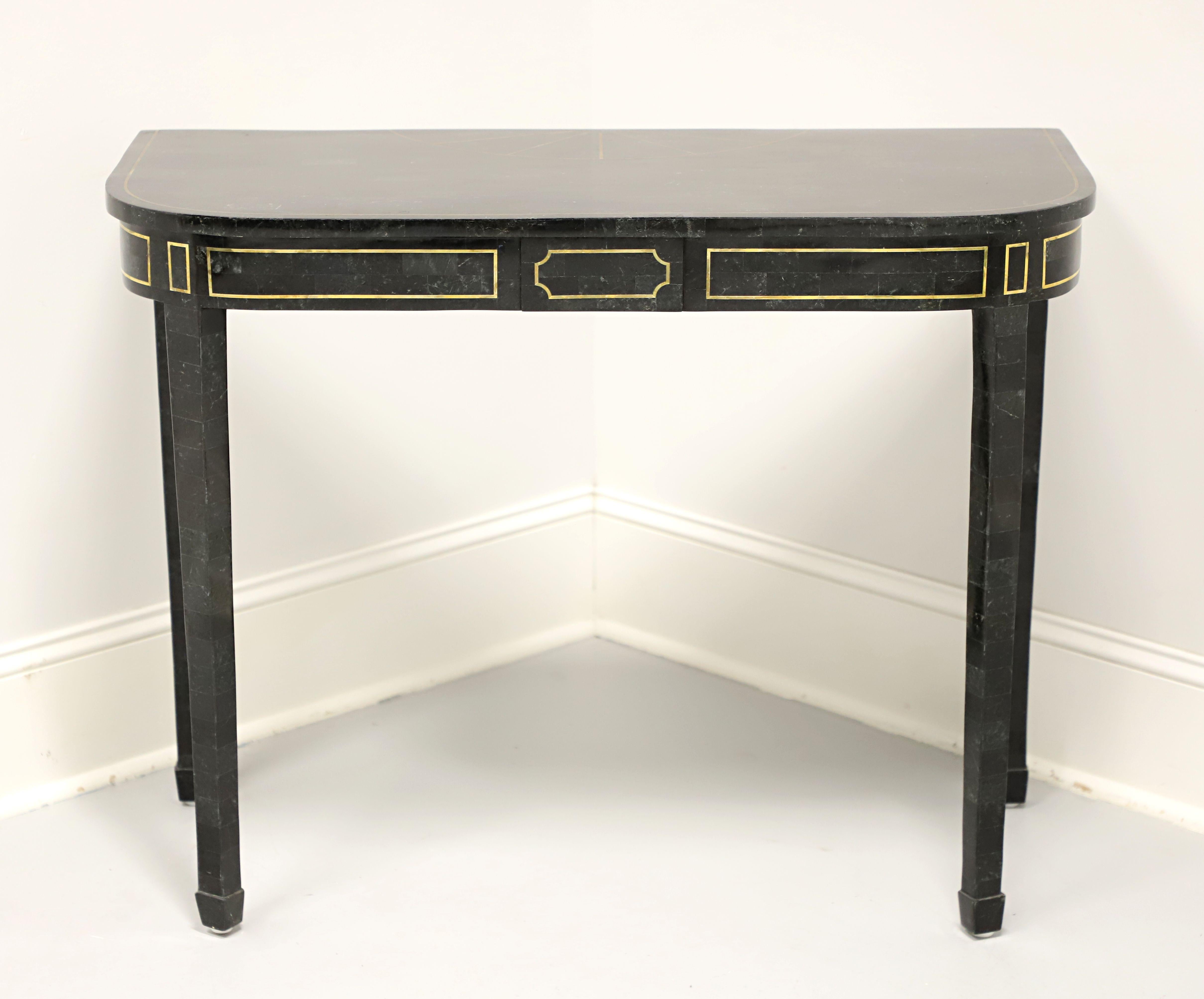 A Neoclassical style console table by Maitland Smith. Solid wood frame with tessellated green/black marble veneers, tessellated marble top with inlaid brass, rounded front corners, brass inlays to the apron, tapered straight legs and spade feet.
