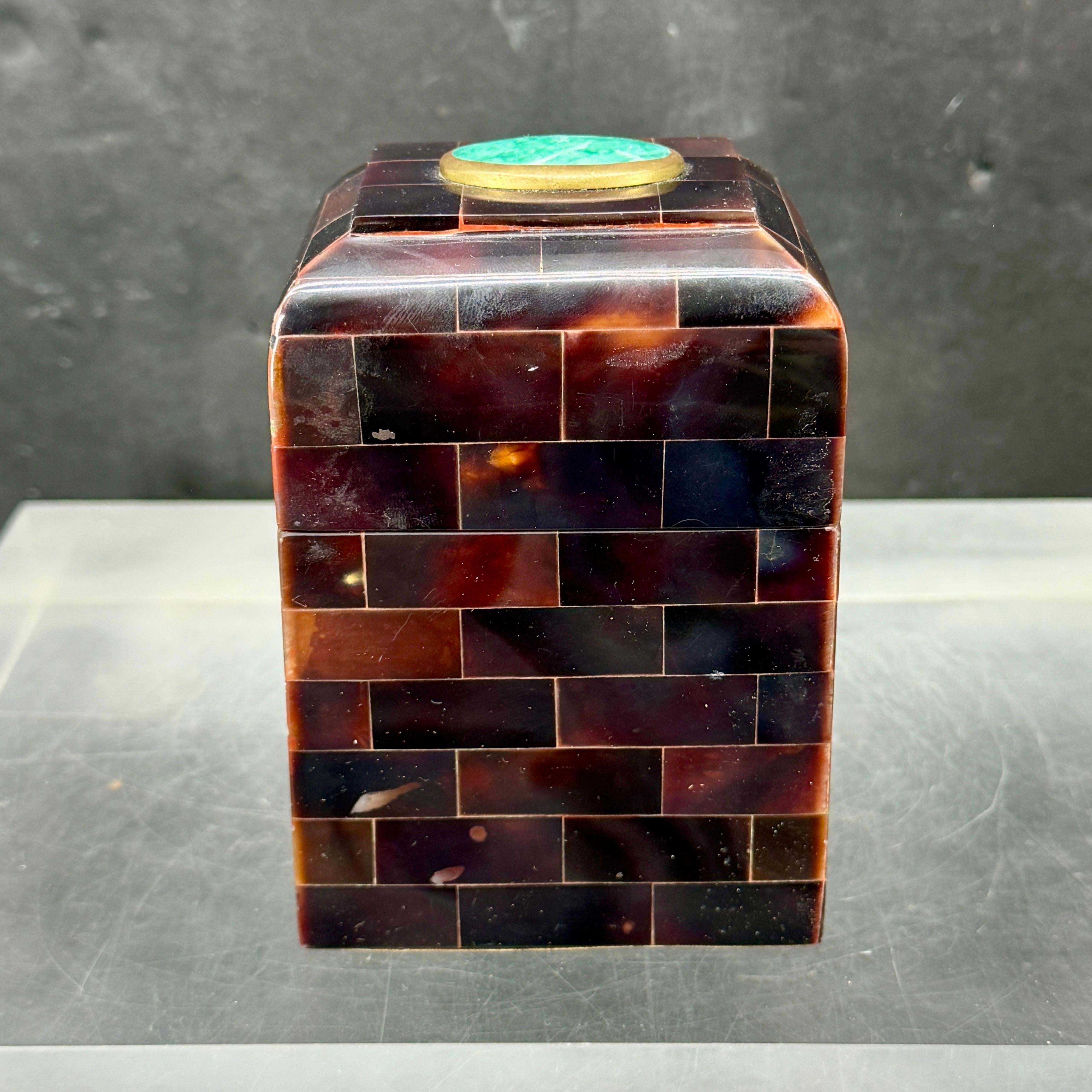Mid-Century Modern architectural tessellated box by Maitland Smith. Both form and function best describe this piece. We see this decorative box holding favorite trinkets as well as sitting on a coffee or side table as display.

