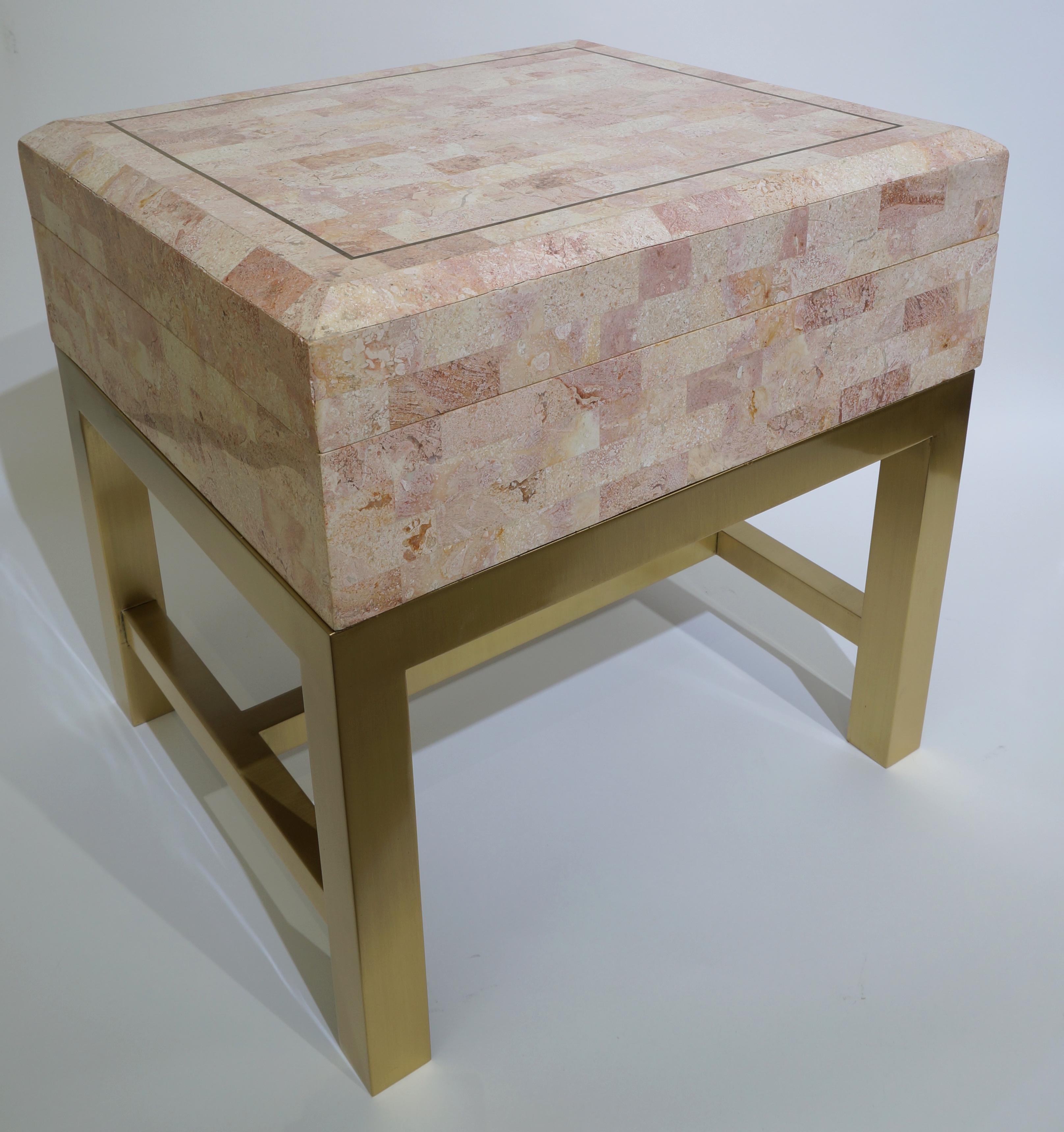 Vintage Maitland Smith Tessellated marble box on satin polished brass stand from a Palm Beach estate

This piece will make the perfect side table as it can store those unsightly remote controls and coasters. The piece was made by Maitland Smith