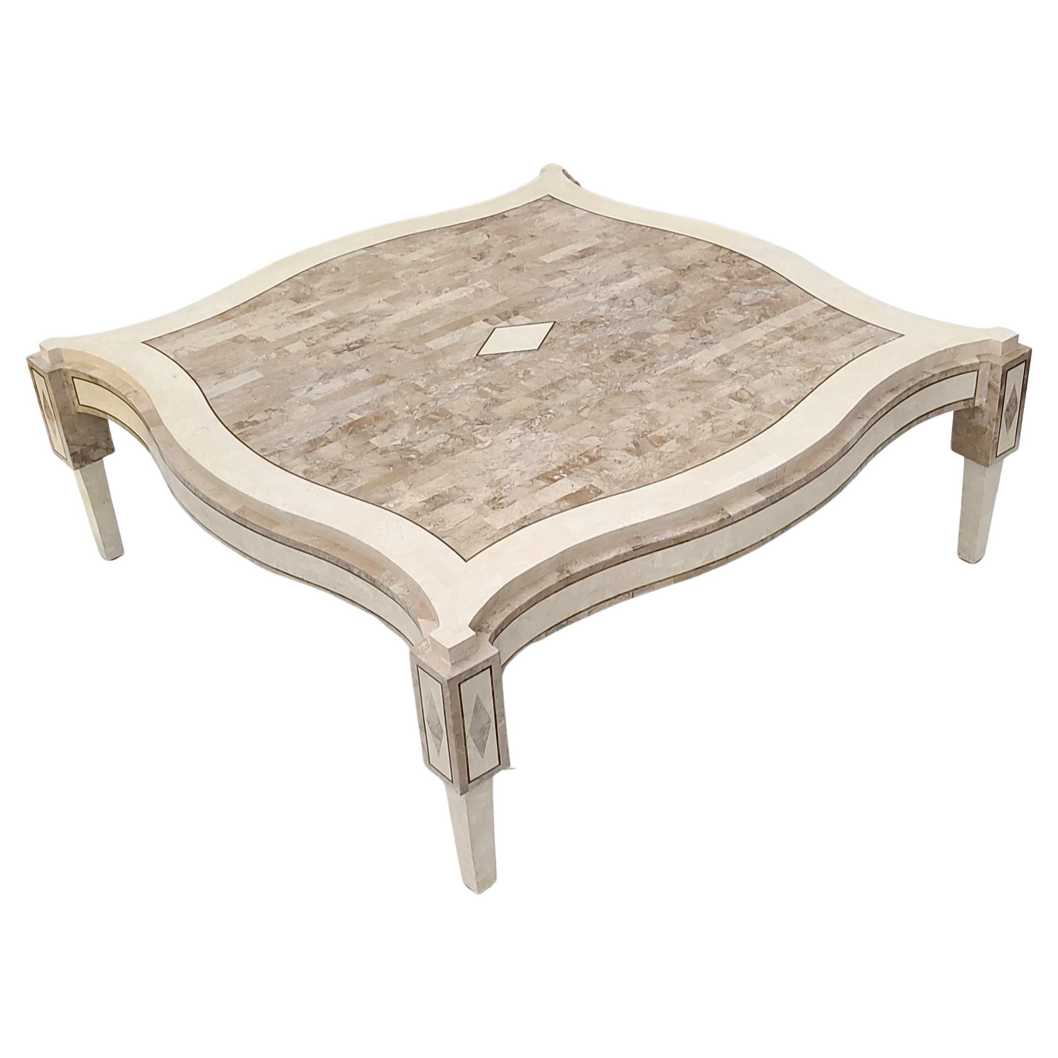 Please reach out for efficient shipping quote to your location.

Elegant tessellated stone coffee table by Maitland Smith.