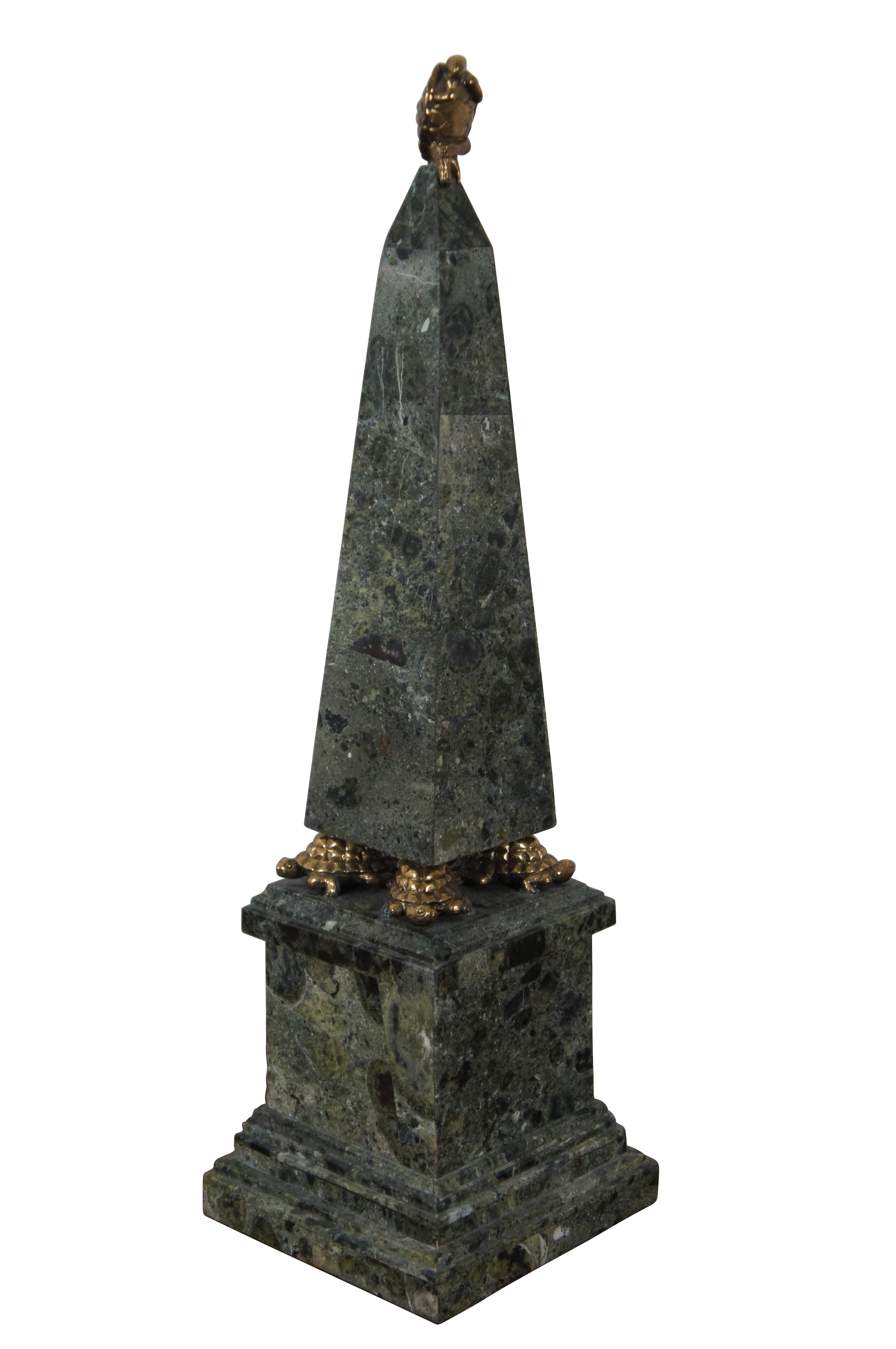 Vintage Maitland Smith stone tesslated marble stone obelisk sculpture standing on the backs of four brass turtles, which in turn sit atop a square pedestal.  At the tip of the obelisk sits another brass turtle, anthropomorphized in the position of