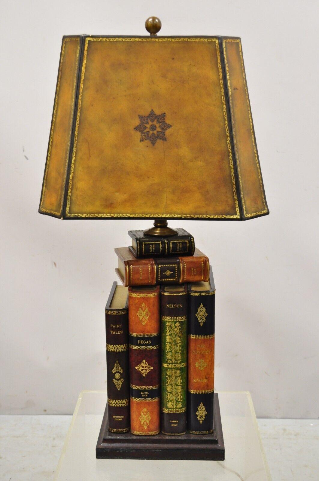 Maitland Smith tooled leather stacked book table lamp with shade. Item features an original shade, tooled leather book form body, original label, very nice vintage item, quality craftsmanship, great style and form, circa late 20th
