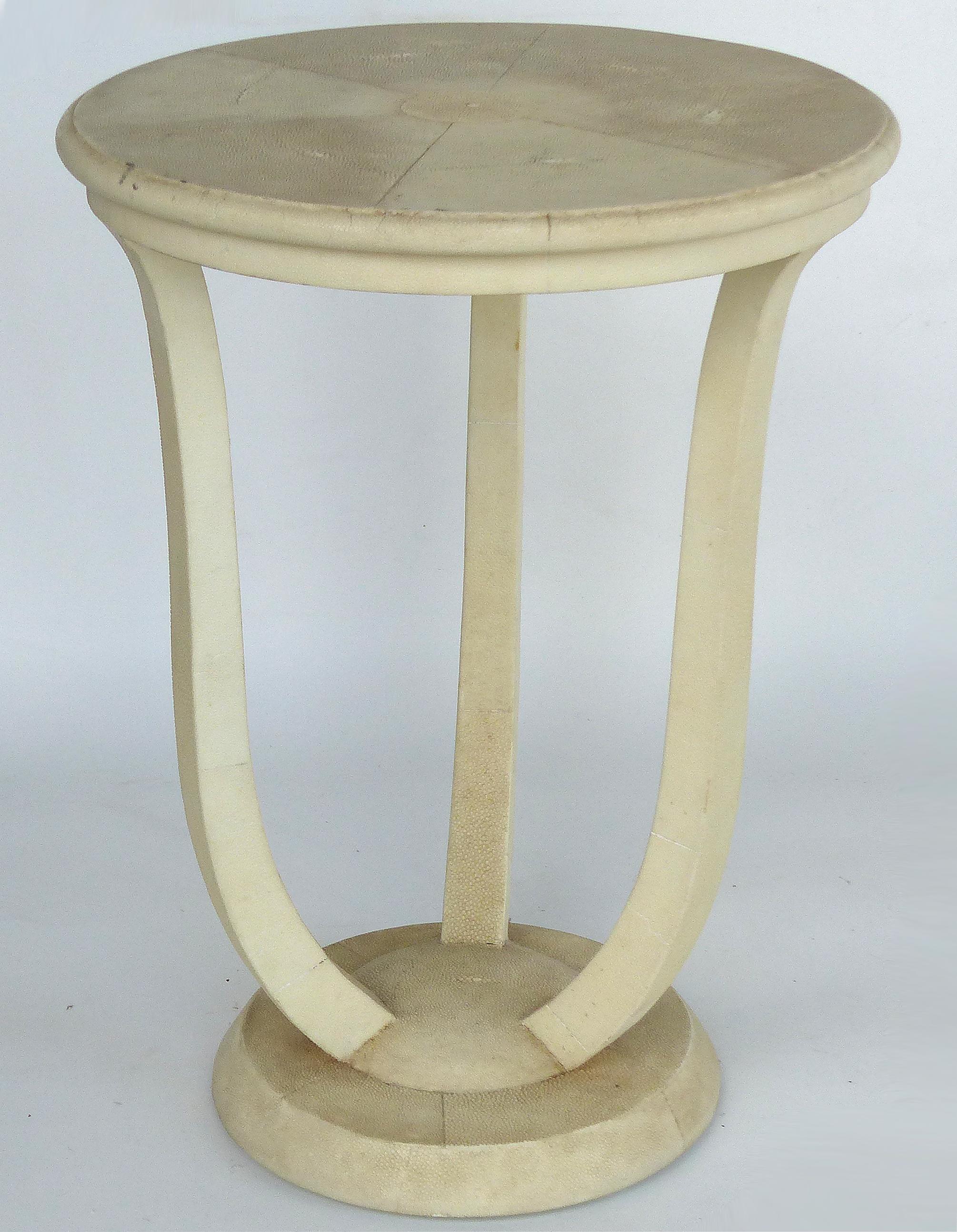 Maitland Smith Tri-Leg Shagreen Side Table

Offered for sale is an occasional table by Maitland Smith clad in an ivory colored shagreen. The tri-leg table has a round base and a round top which measures 18.75