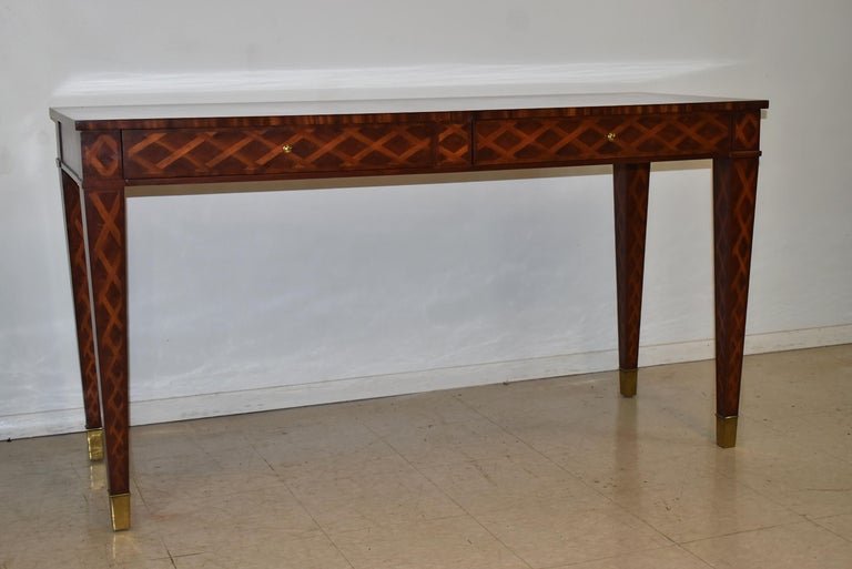 Maitland Smith two drawer mahogany server console table. Inlay top and finished back and sides. Brass hardware and toe caps on tapered legs. Very nice condition. Dimensions: 22.5