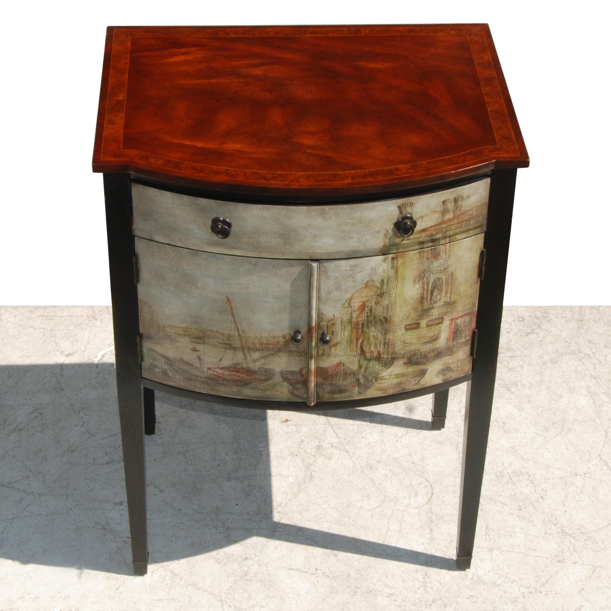 Maitland Smith Venetian style nightstand or end table

 
Wood cabinet is adorned in front and sides with a hand-painted European scene.
Top drawer and lower cabinet has antiqued pulls.
Antiqued cherry top with ebonized legs.
 